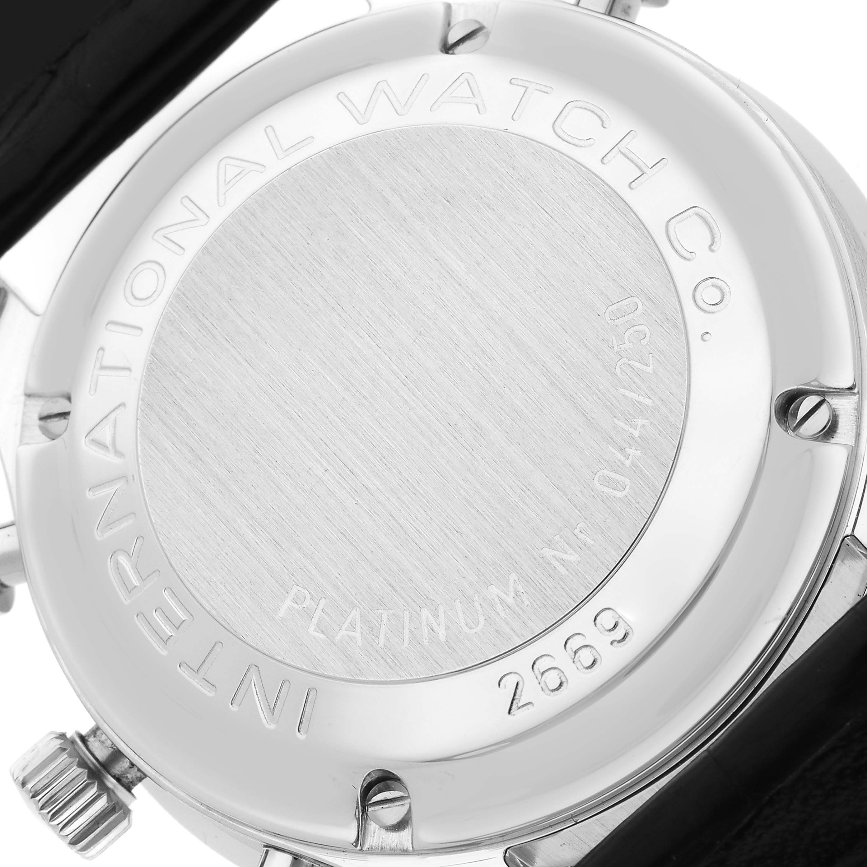 The image shows the back case of an IWC Portuguese IW3711205 Men's Platinum Silver Dial IW3711205 Men's Platinum Silver Dial model watch, showcasing engravings and the strap attachment.