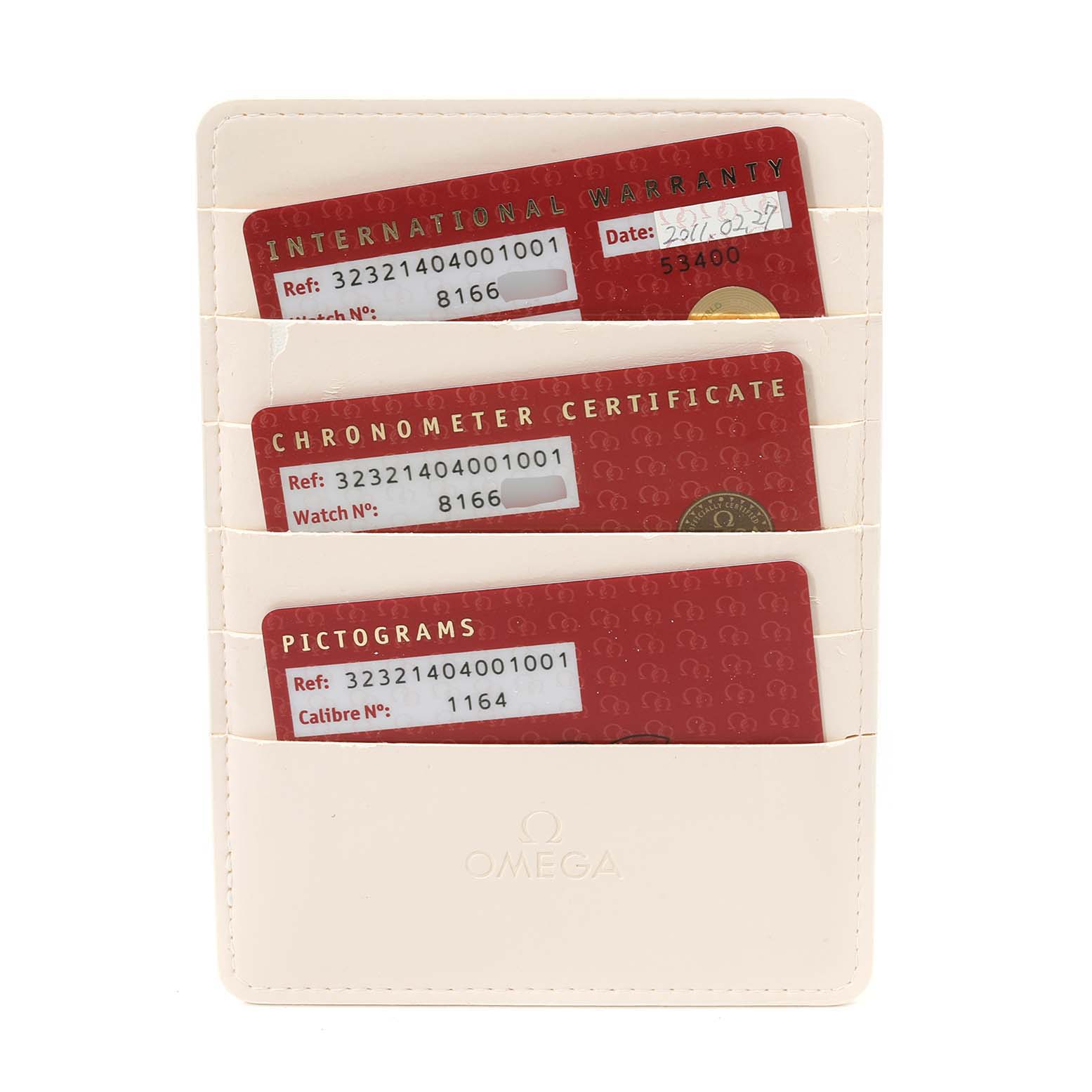 The image shows three documentation cards in a holder for an Omega Speedmaster 323.21.40.40.01.001 Men's Steel and Gold (two tone) Black Dial 323.21.40.40.01.001 Men's Steel and Gold (two tone) Black Dial watch, including warranty and certification cards, shot from above.