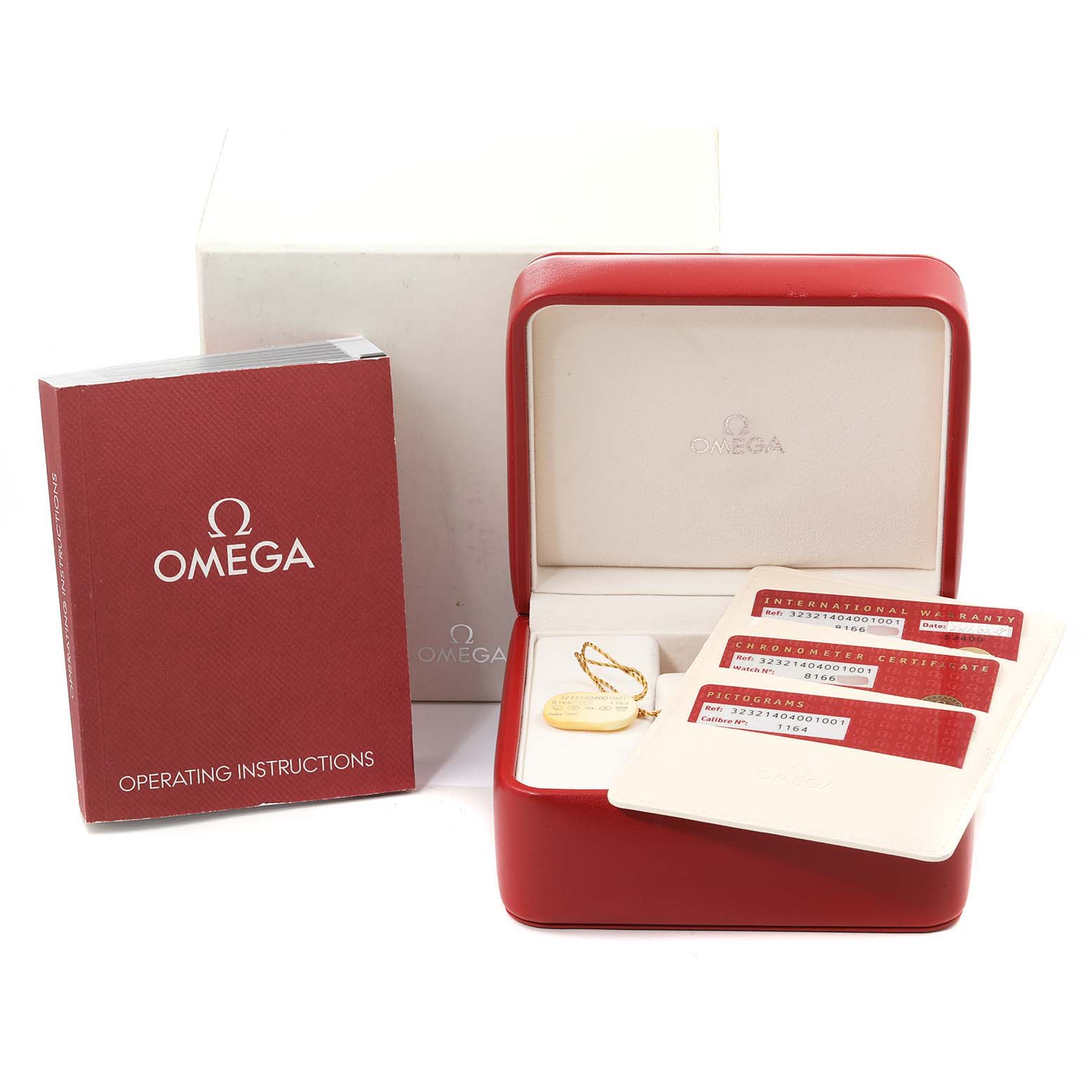 The image shows accessories for an Omega Speedmaster 323.21.40.40.01.001 Men's Steel and Gold (two tone) Black Dial 323.21.40.40.01.001 Men's Steel and Gold (two tone) Black Dial, including the box, manual, and authenticity cards, viewed from a front angle.