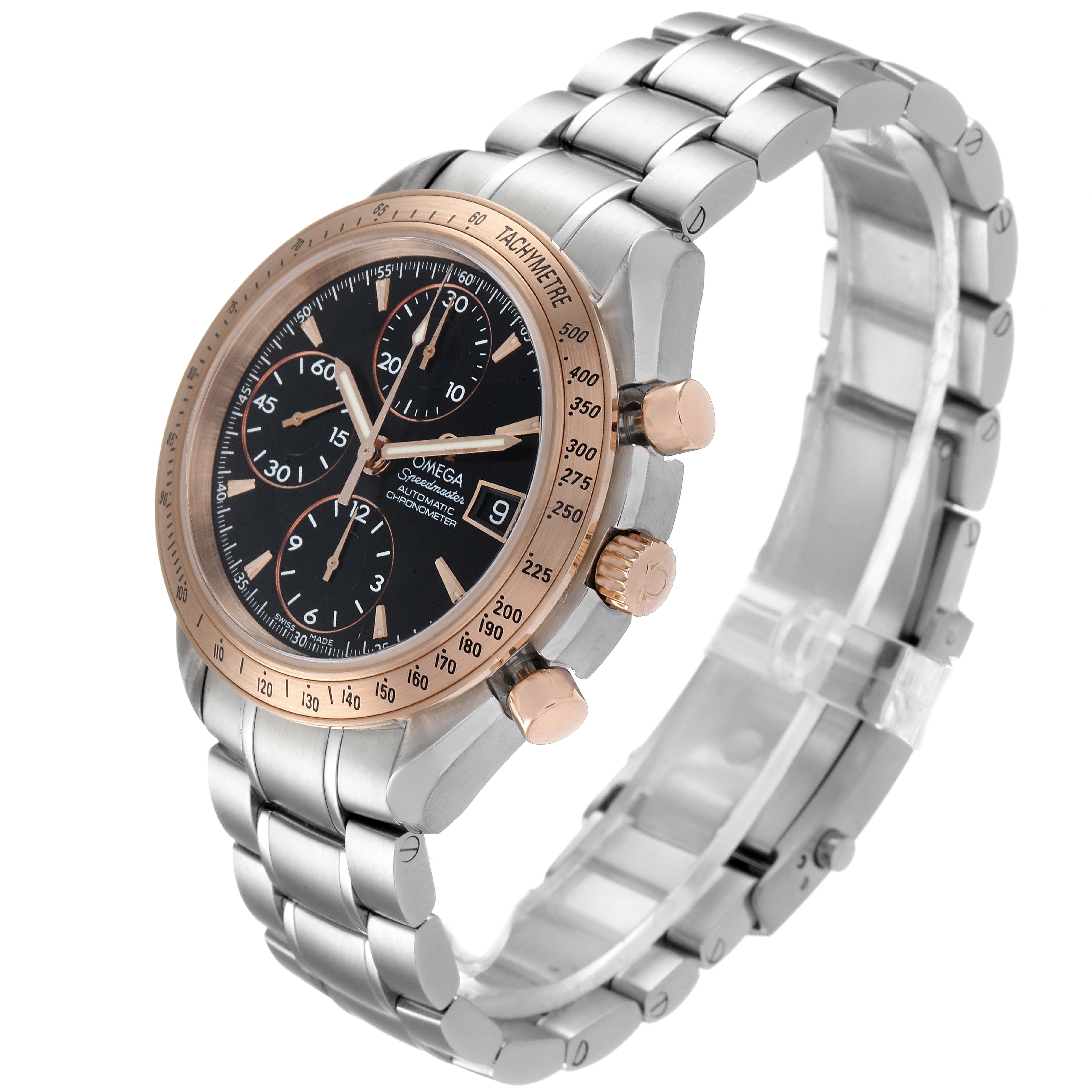 The Omega Speedmaster 323.21.40.40.01.001 Men's Steel and Gold (two tone) Black Dial 323.21.40.40.01.001 Men's Steel and Gold (two tone) Black Dial watch is shown at a three-quarters angle, displaying its face, bezel, pushers, crown, and bracelet.