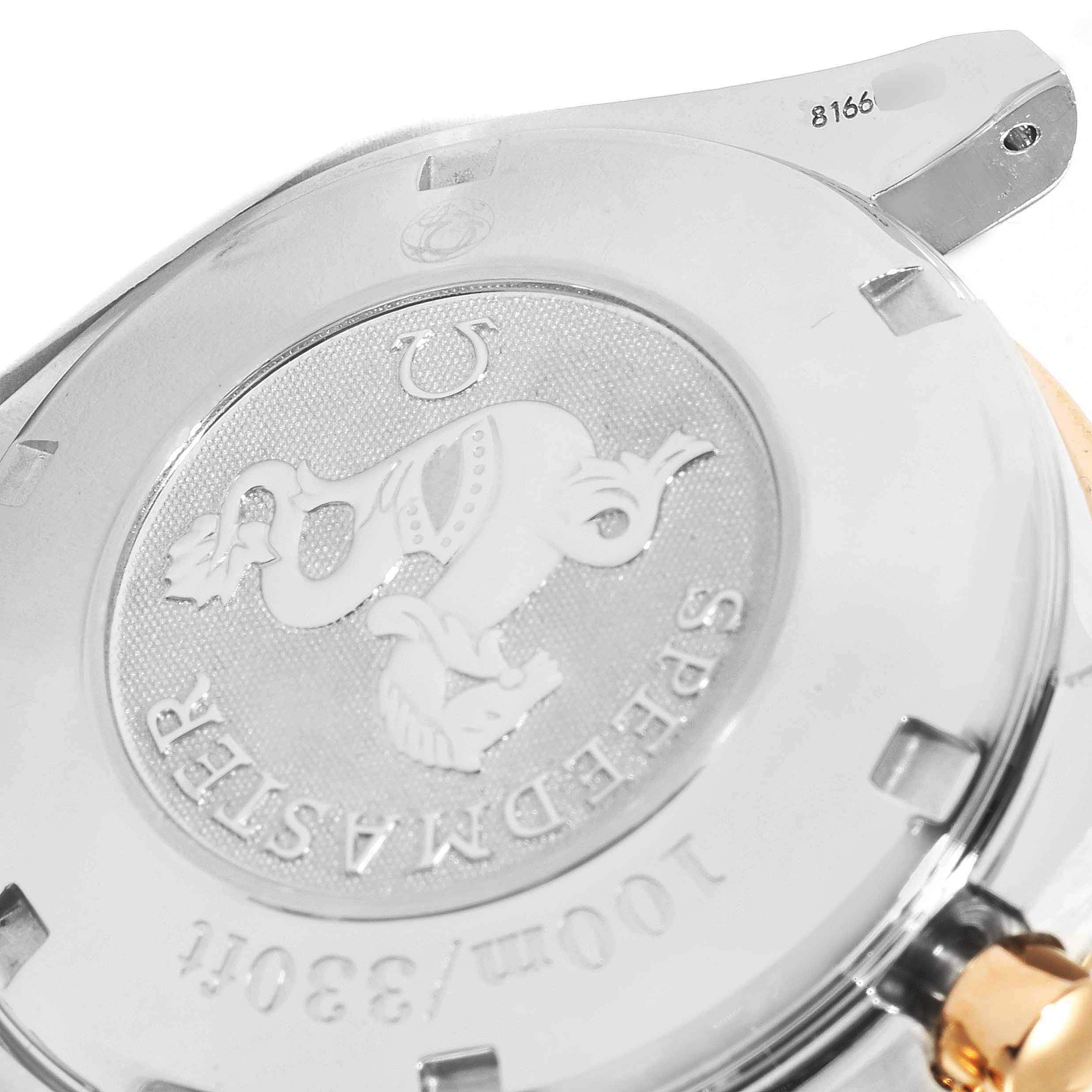 This image shows the back case of an Omega Speedmaster 323.21.40.40.01.001 Men's Steel and Gold (two tone) Black Dial 323.21.40.40.01.001 Men's Steel and Gold (two tone) Black Dial watch, highlighting the engraved logo and model details.