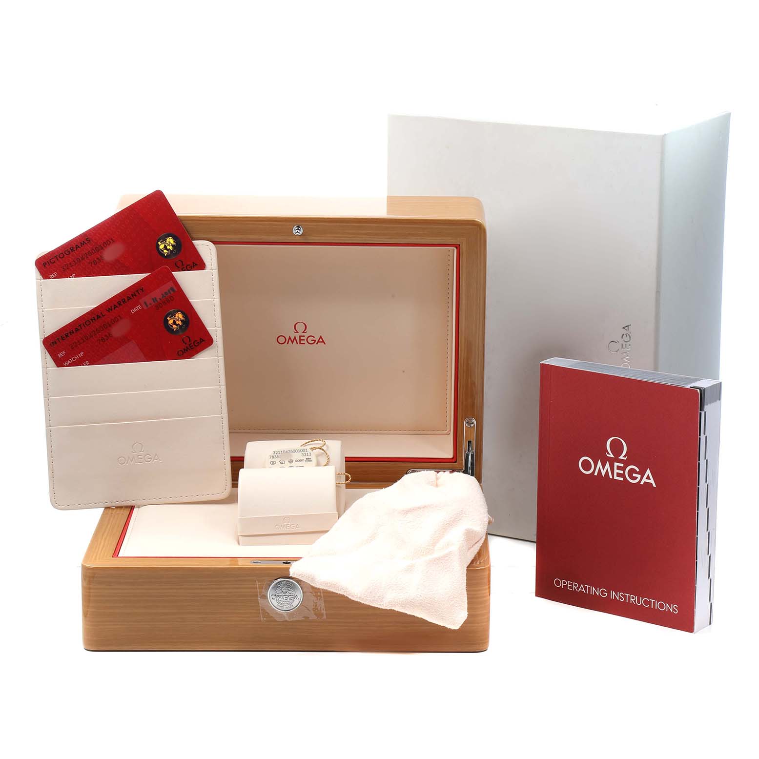 The image shows an Omega Speedmaster 321.10.42.50.01.001 Men's Stainless Steel Black Dial watch box with cards, a cleaning cloth, and an instruction booklet.