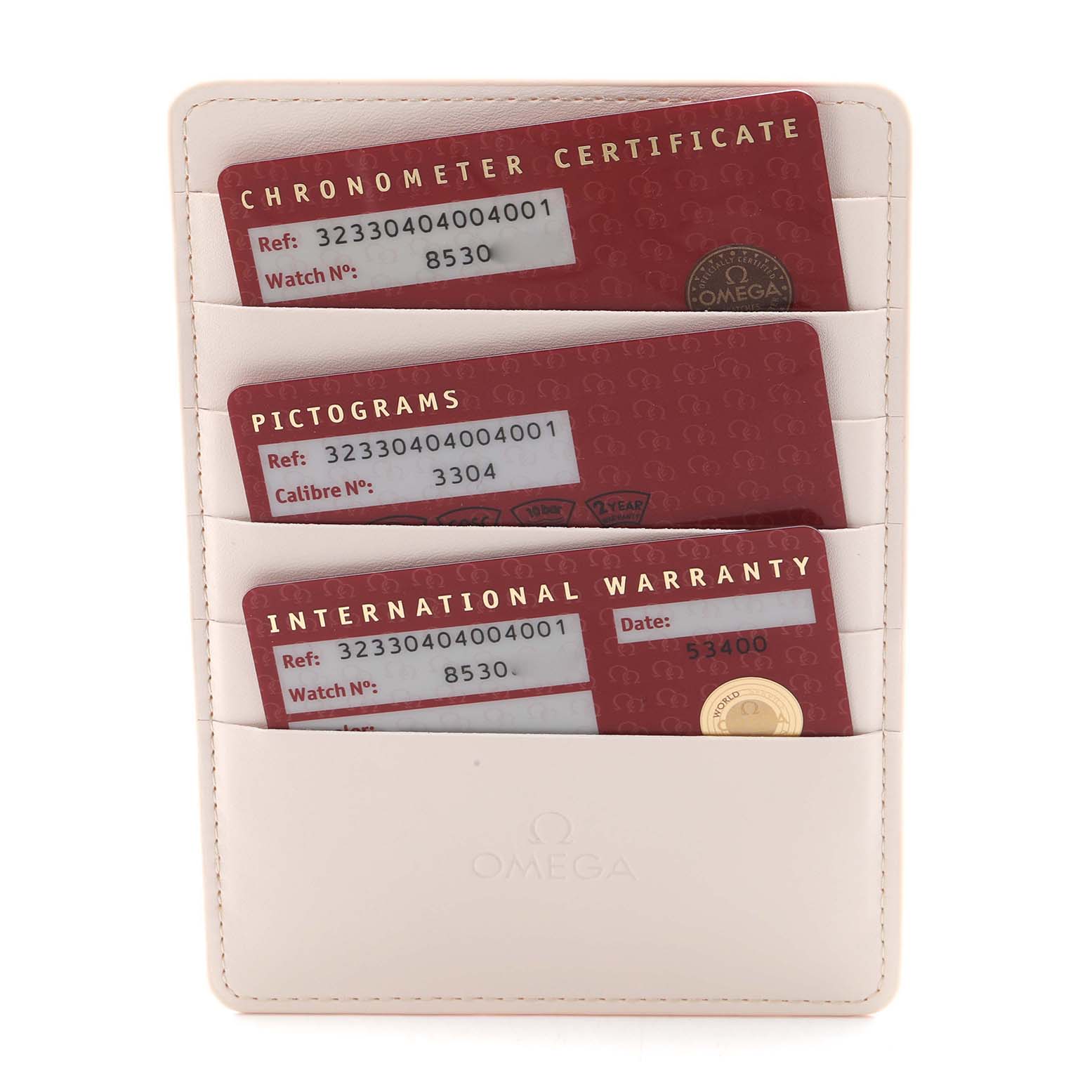 The image shows warranty cards in a holder for the Omega Speedmaster 323.30.40.40.04.001 Men
s Stainless Steel Silver Dial 323.30.40.40.04.001 Men
s Stainless Steel Silver Dial watch model.