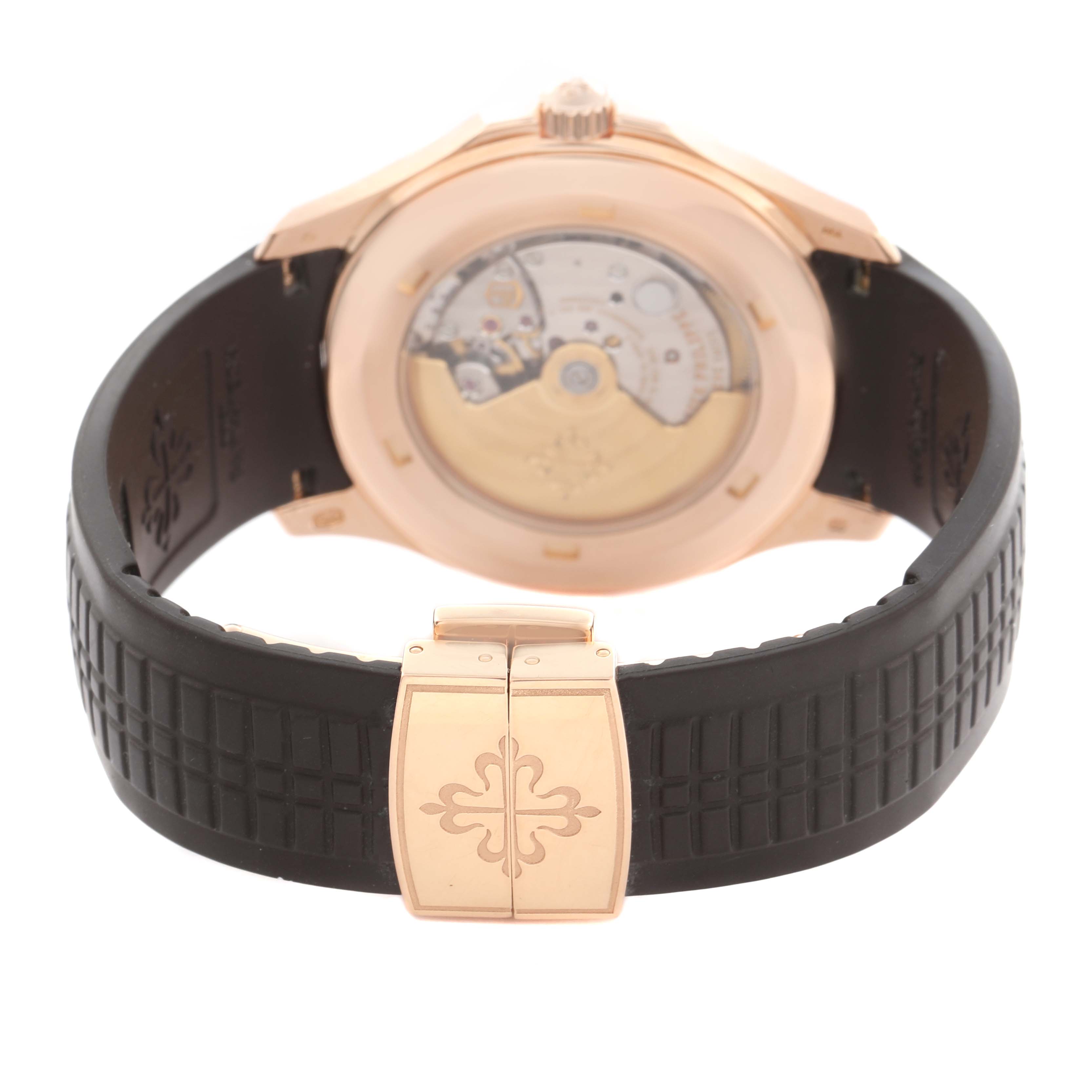 The image shows the back view of a Patek Philippe Aquanaut 5167R-001 Men
s Rose Gold Brown Dial 5167R-001 Men
s Rose Gold Brown Dial watch, highlighting the movement through a transparent case back and clasp.