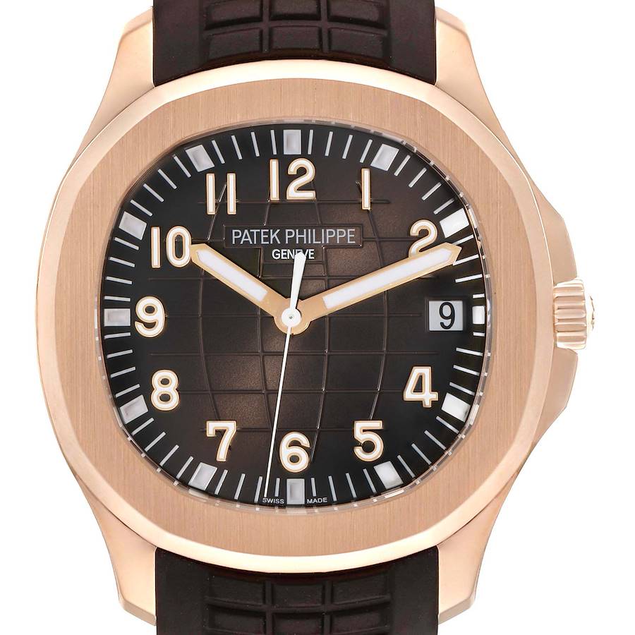 The image shows a frontal view of a Patek Philippe Aquanaut watch, highlighting its brown dial, numerals, and date display.