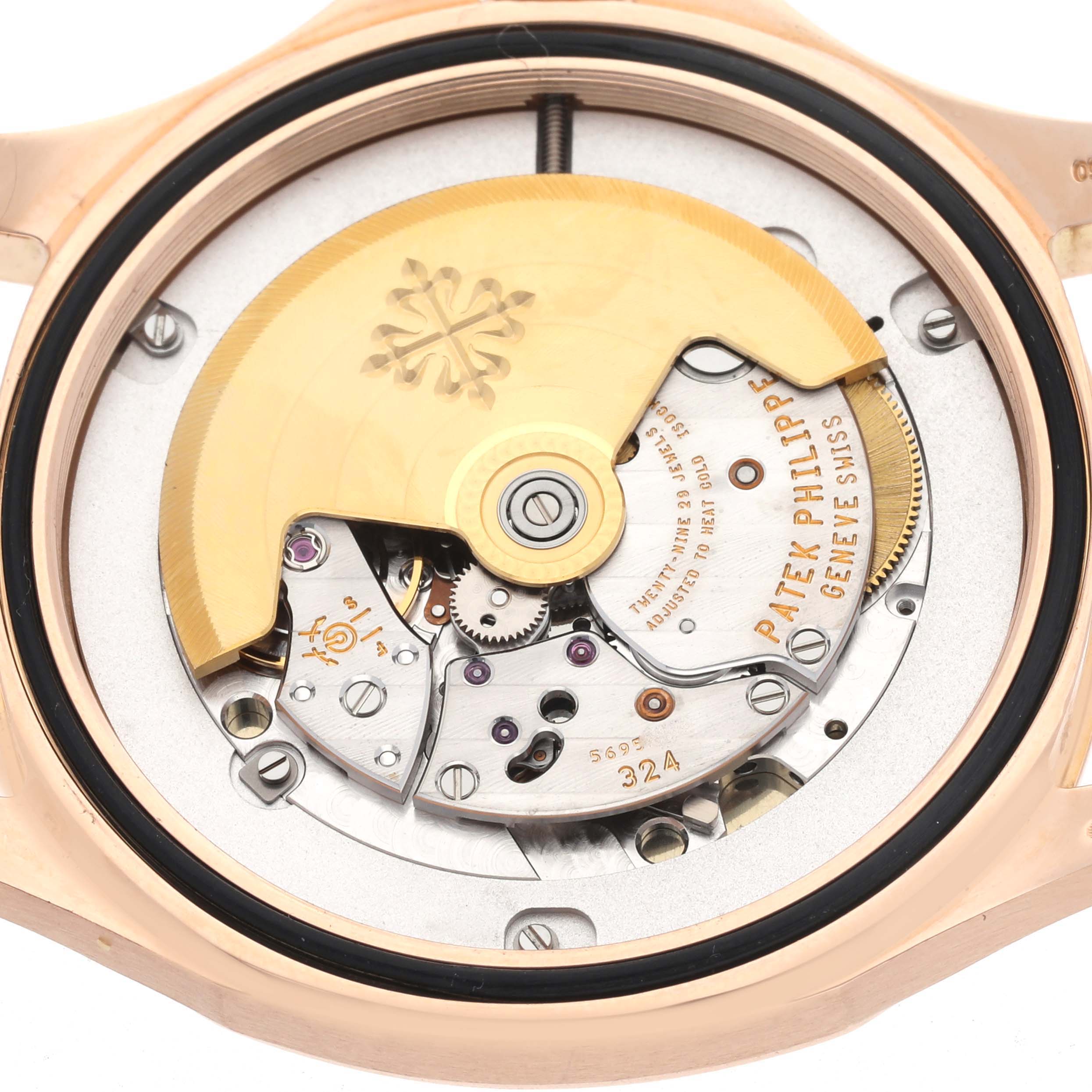 The image shows the back view of a Patek Philippe Aquanaut 5167R-001 Men
s Rose Gold Brown Dial 5167R-001 Men
s Rose Gold Brown Dial, highlighting its movement and rotor.