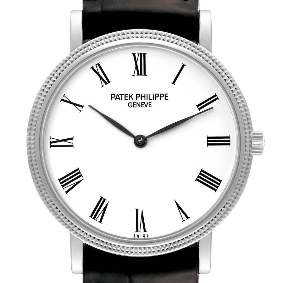 The image shows a close-up of the dial, bezel, and crown of a Patek Philippe Calatrava watch from a front angle.