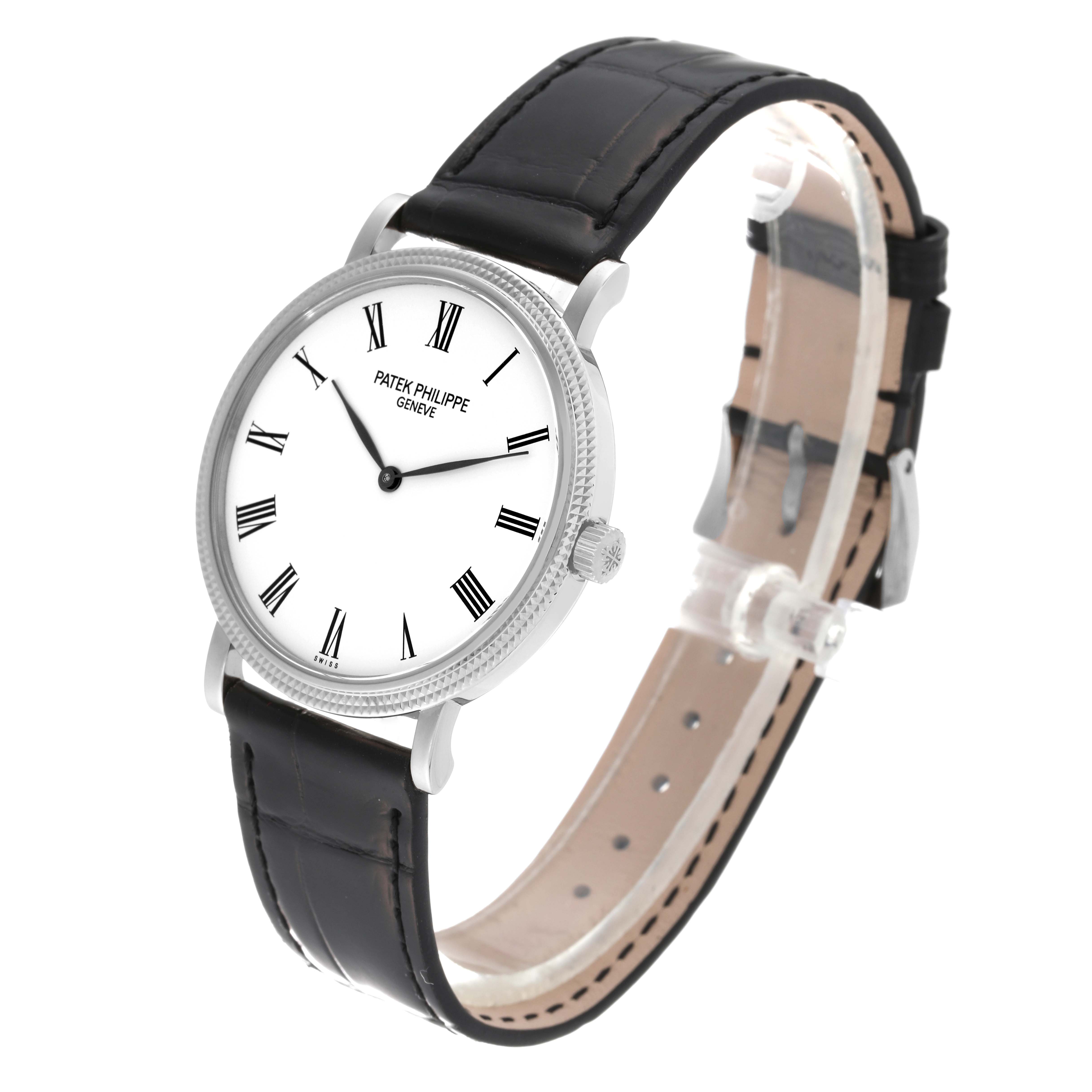 The image shows a Patek Philippe Calatrava 5120 Men
s White Gold White Dial 5120 Men
s White Gold White Dial watch from a front-side angle, highlighting the dial, case, and black leather strap.