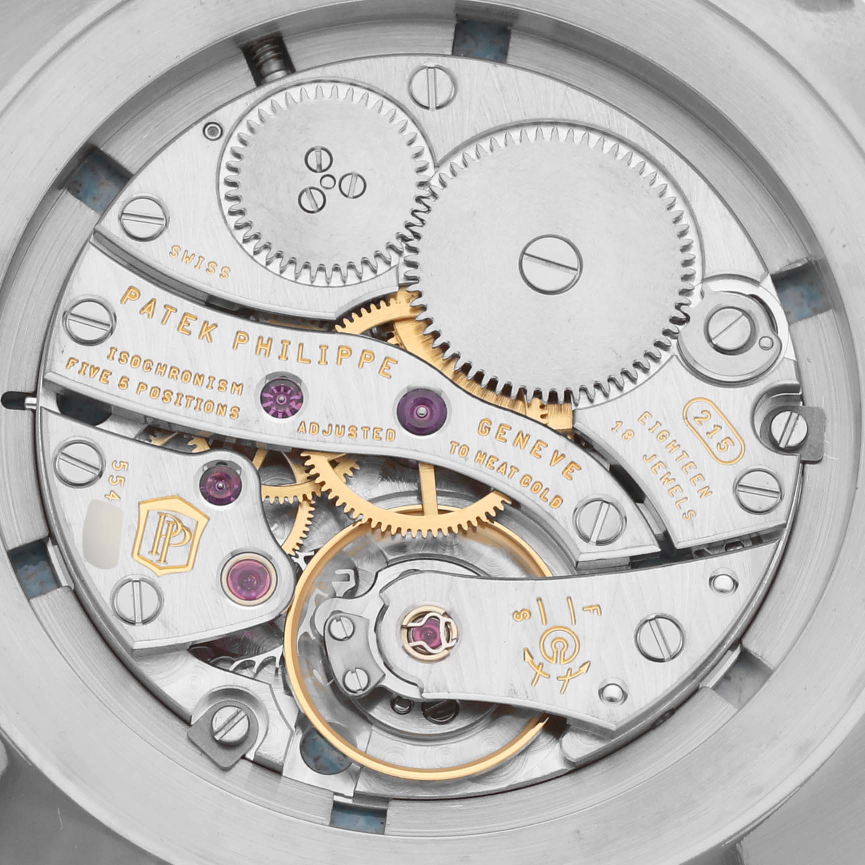 The image shows the intricate movement components of a Patek Philippe Calatrava 5116G Men
s White Gold White Dial 5116G Men
s White Gold White Dial watch at a close-up angle.