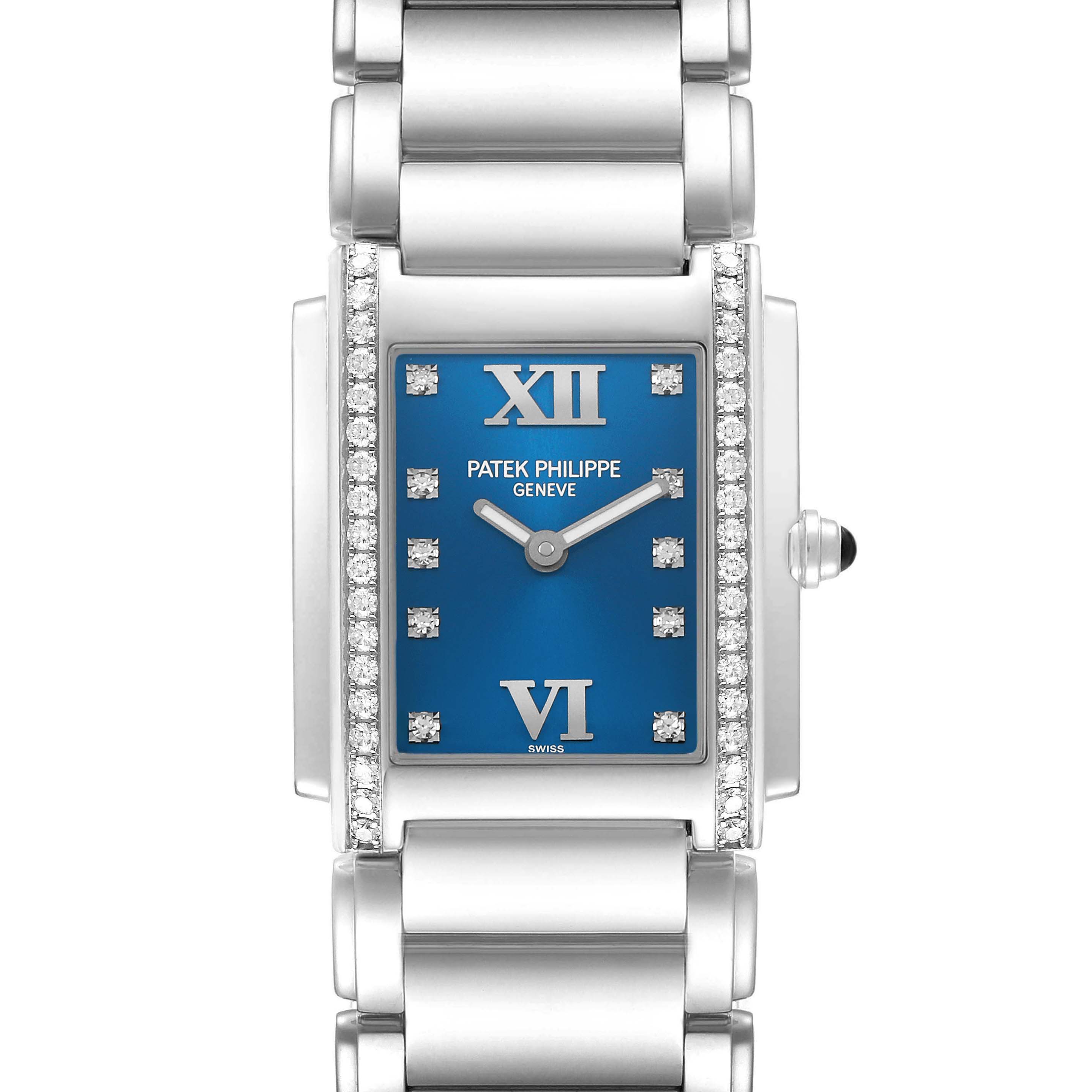The Patek Philippe Twenty-4 4910/10A-012 Women's Stainless Steel Blue Dial watch is shown from a front angle, displaying its blue dial, silver bracelet, and diamond accents.