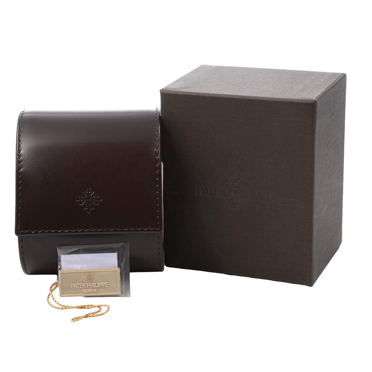 The image shows a Patek Philippe Twenty-4 4910/10A-012 Women's Stainless Steel Blue Dial watch box, a leather pouch, and a tag with branding from a front angle.
