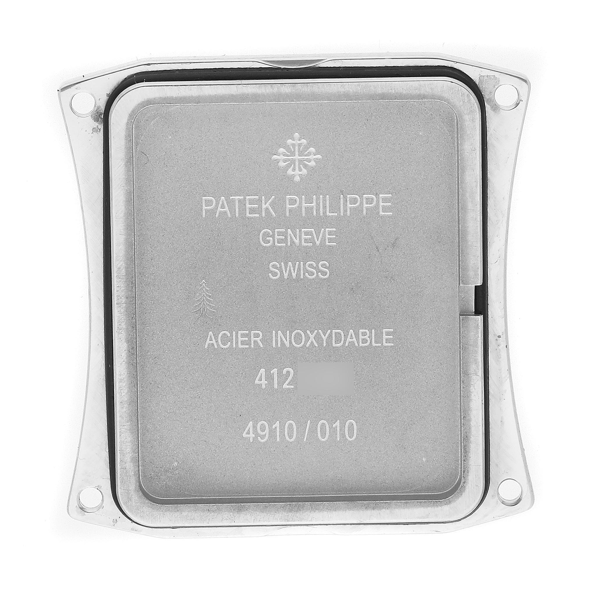 The image shows the back case of a Patek Philippe Twenty-4 4910 Women
s Stainless Steel Silver Dial 4910 Women
s Stainless Steel Silver Dial watch from a top-down angle.