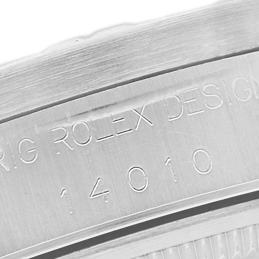 The image shows a close-up of the engraved inner case of a Rolex Air-King 14010 Men's Stainless Steel Silver Dial 14010 Men's Stainless Steel Silver Dial watch, featuring design details and model number.