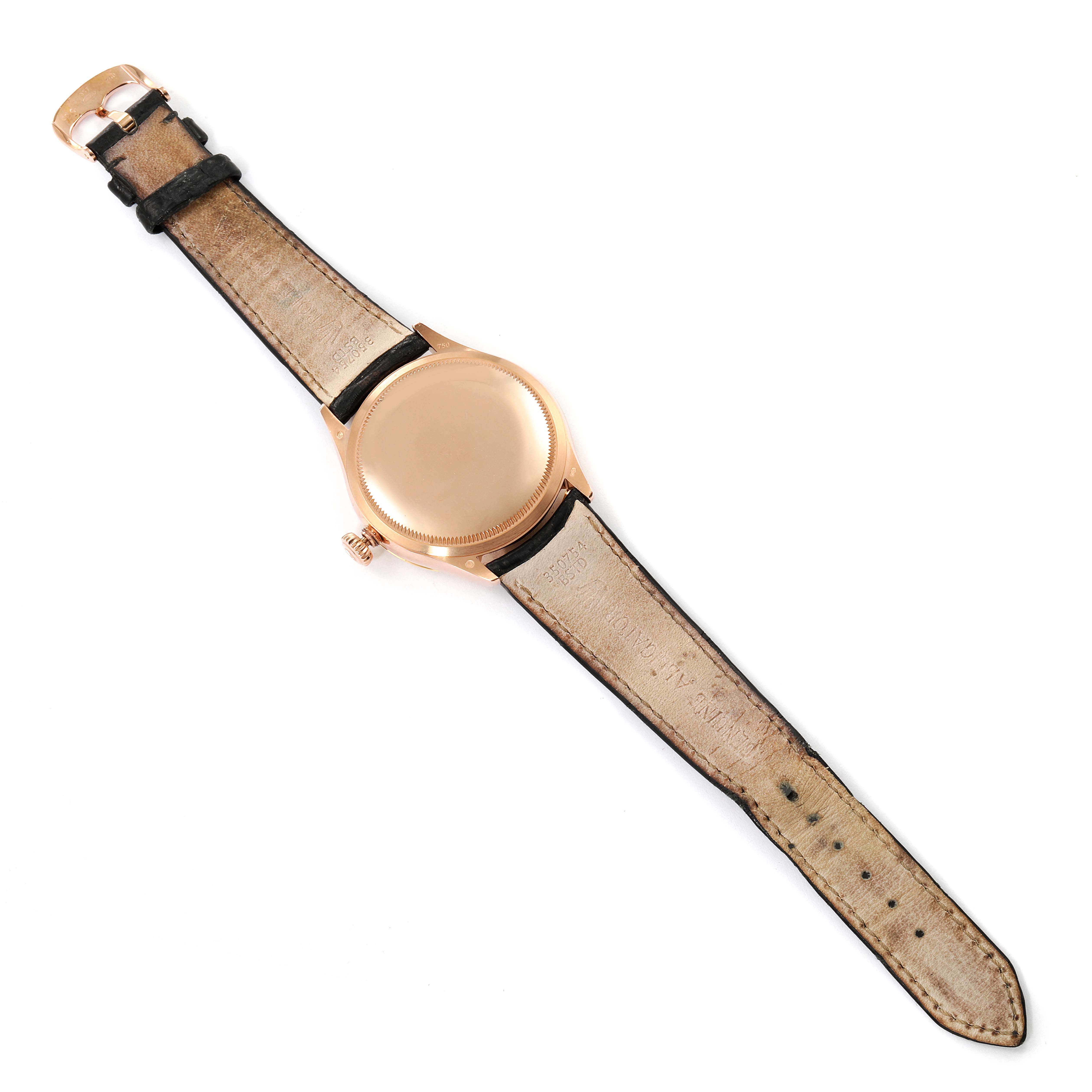 The image shows the back view of a Rolex Cellini 50705 Men's Rose Gold Pink Dial 50705 Men's Rose Gold Pink Dial watch, highlighting its caseback and leather strap.