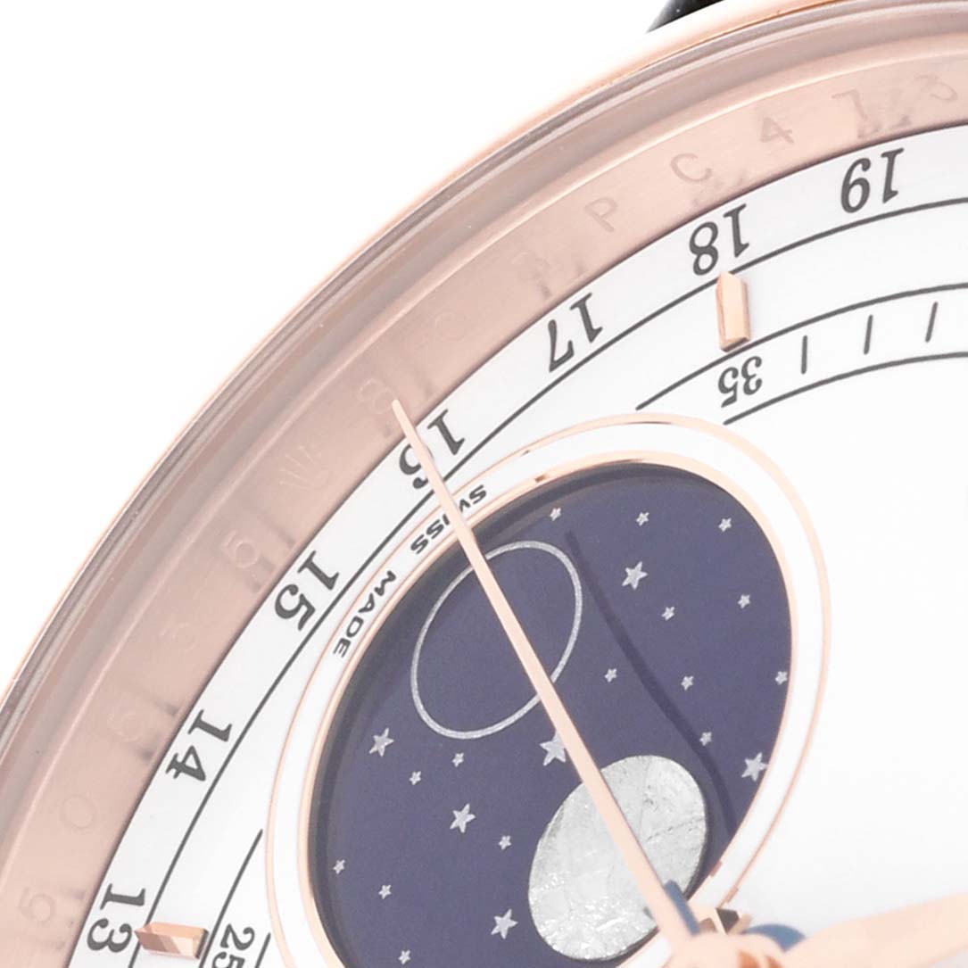 This close-up shows the dial and moon phase complication of the Rolex Cellini 50535 Men's Rose Gold White Dial 50535 Men's Rose Gold White Dial watch.