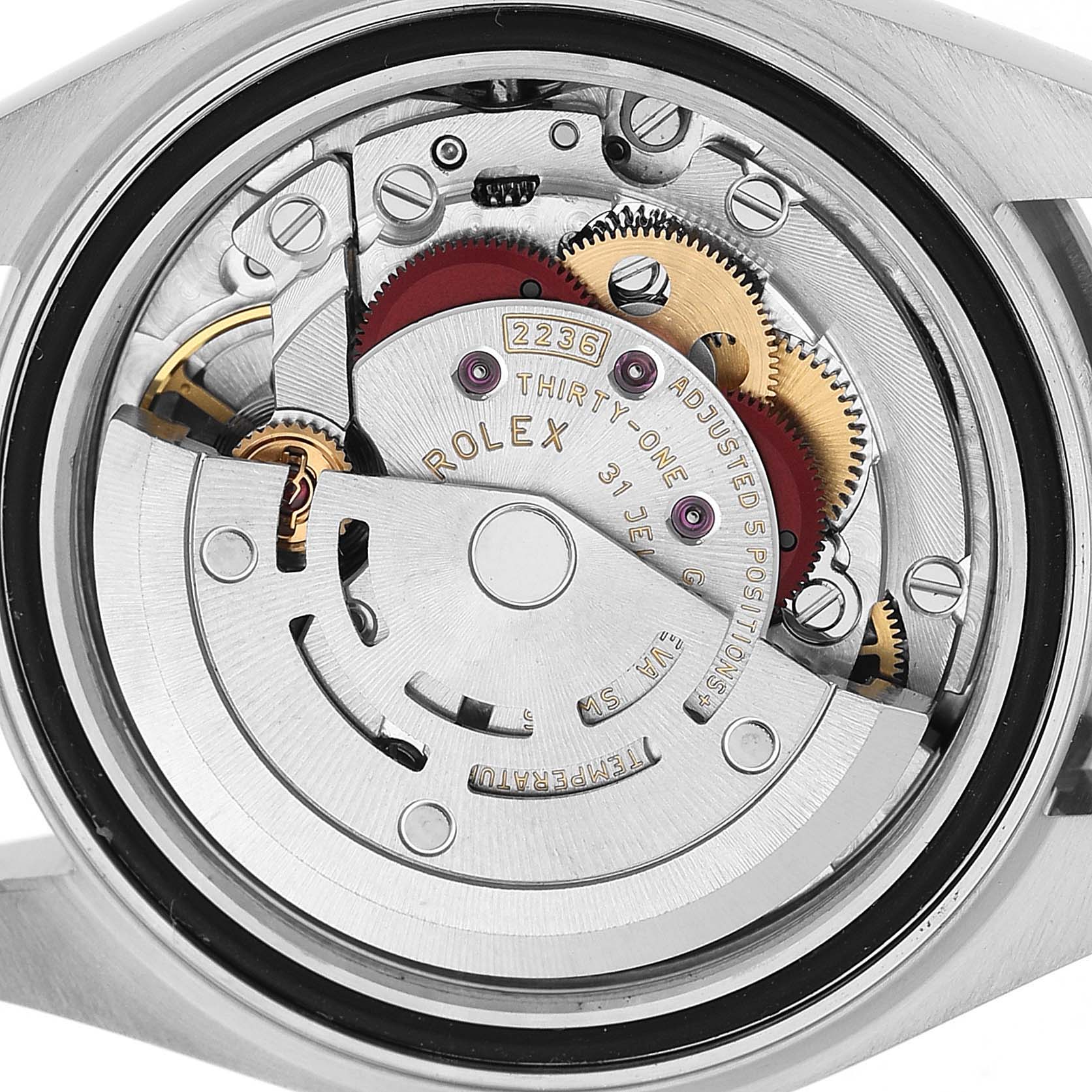The image shows the movement of the Rolex Datejust 279160 Women's Stainless Steel Silver Dial watch from the back, highlighting gears and the rotor.