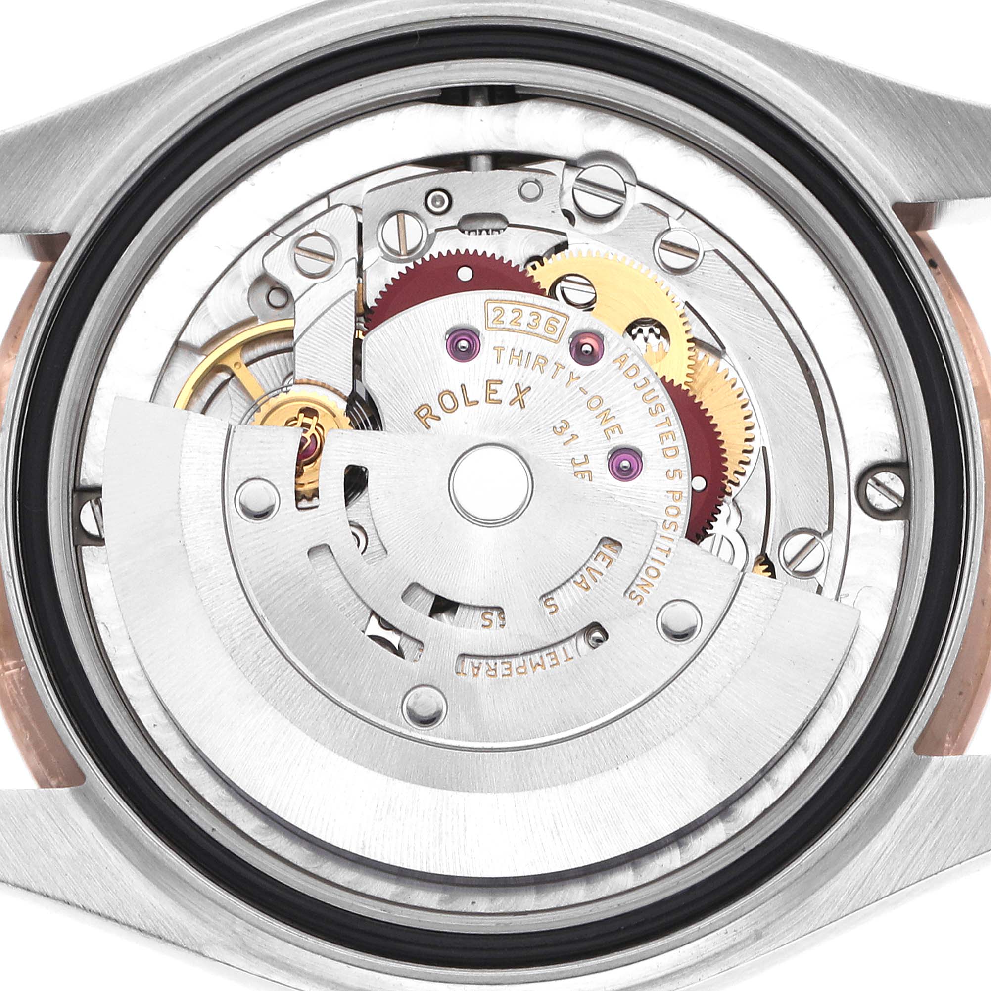 The image shows the movement mechanism of a Rolex Datejust watch from a rear angle.
