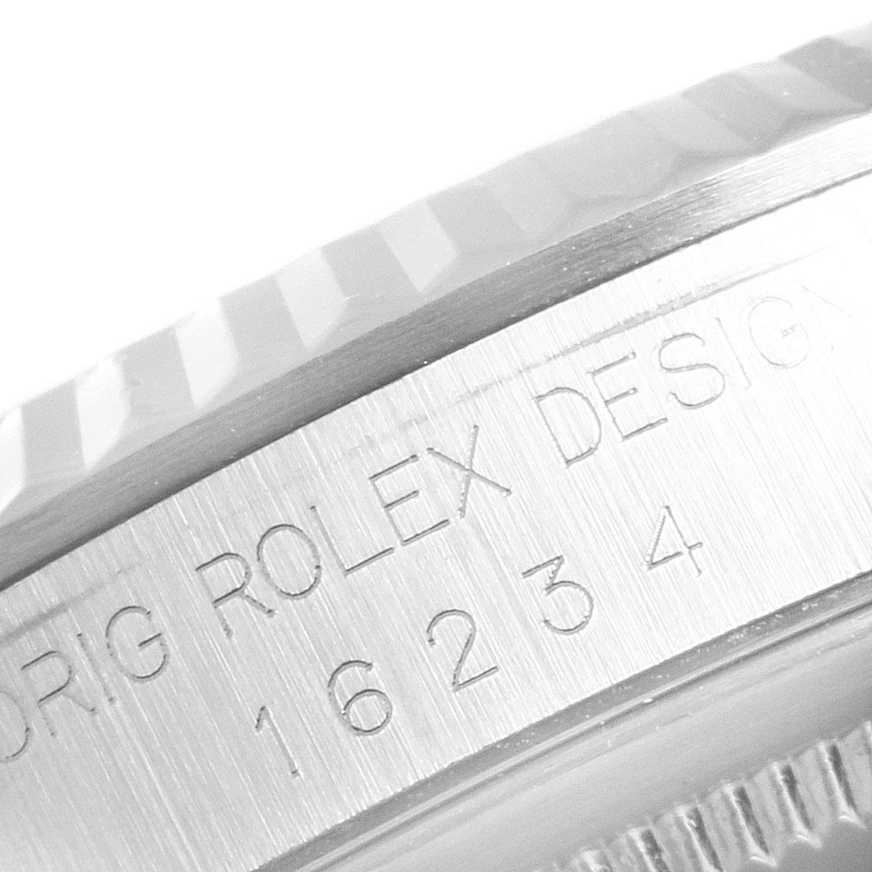 This image shows a close-up of the side of the bezel and case of a Rolex Datejust 16234 Men's Stainless Steel Black Dial 16234 Men's Stainless Steel Black Dial watch, displaying its model number.