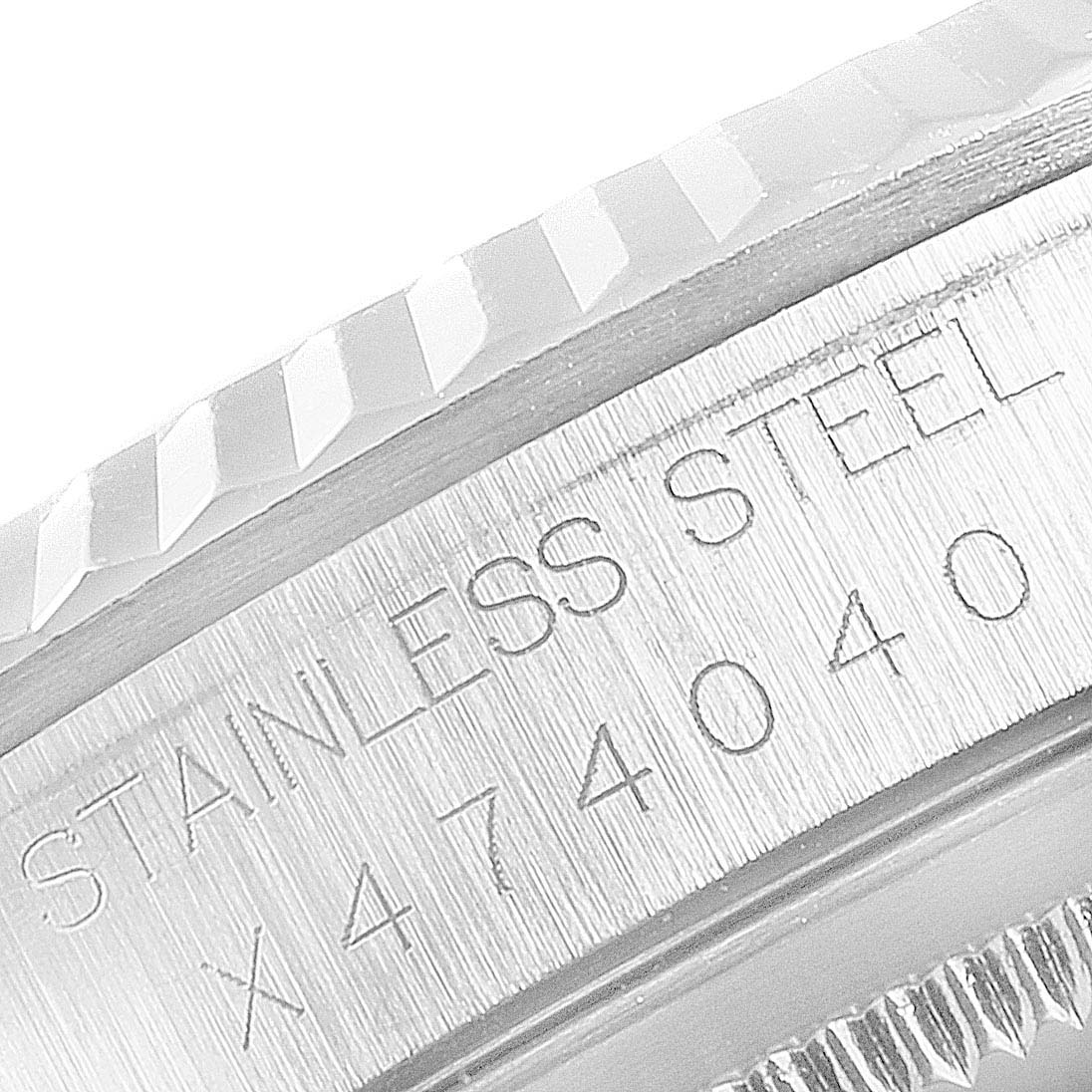 The image shows a close-up of the stainless steel bezel and case of a Rolex Datejust 16234 Men's Stainless Steel Black Dial 16234 Men's Stainless Steel Black Dial watch, featuring the text "STAINLESS STEEL" and model number.