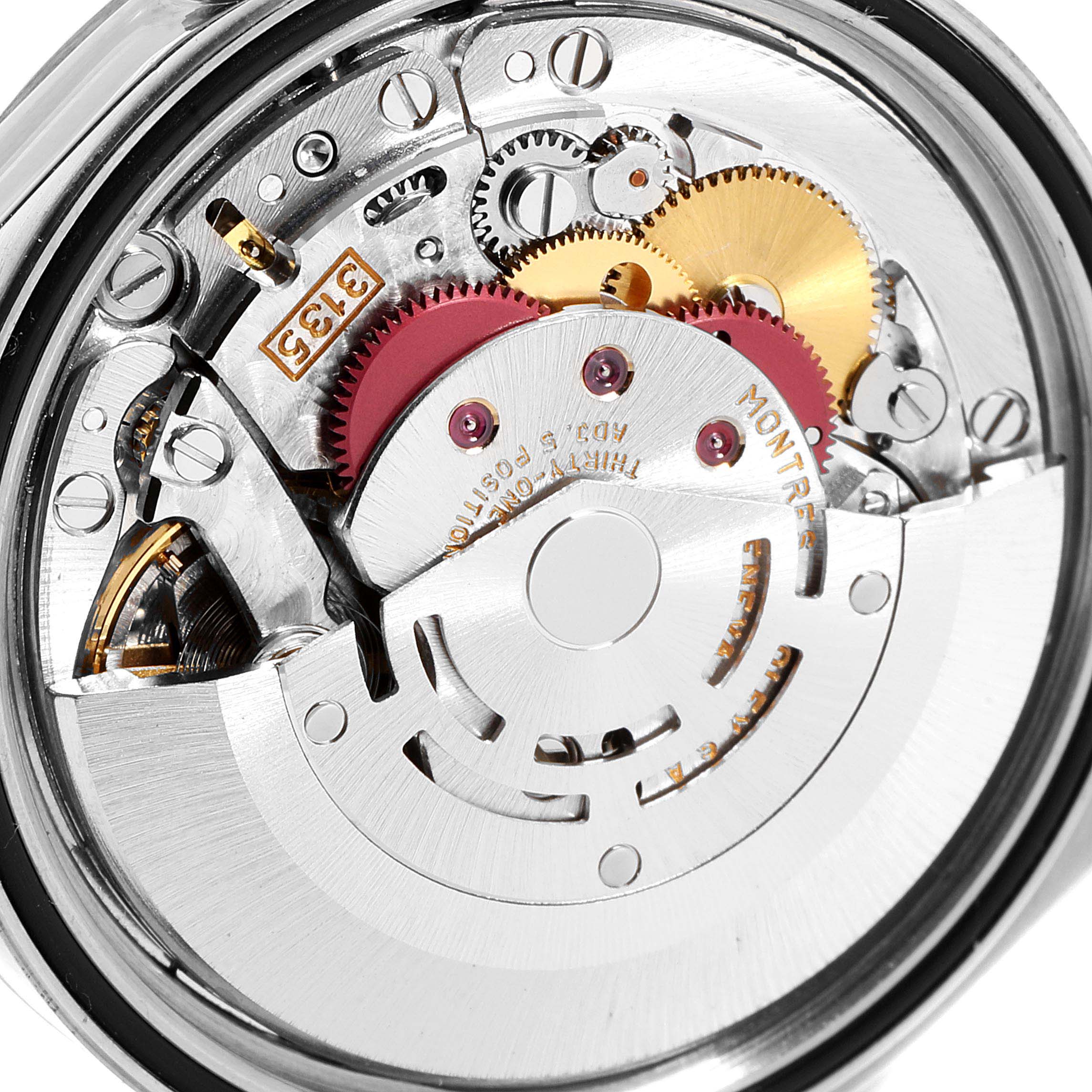 This image shows the intricate internal mechanics of a Rolex Datejust 16234 Men's Stainless Steel Black Dial 16234 Men's Stainless Steel Black Dial watch, highlighting the gear train and rotor from a top-down perspective.