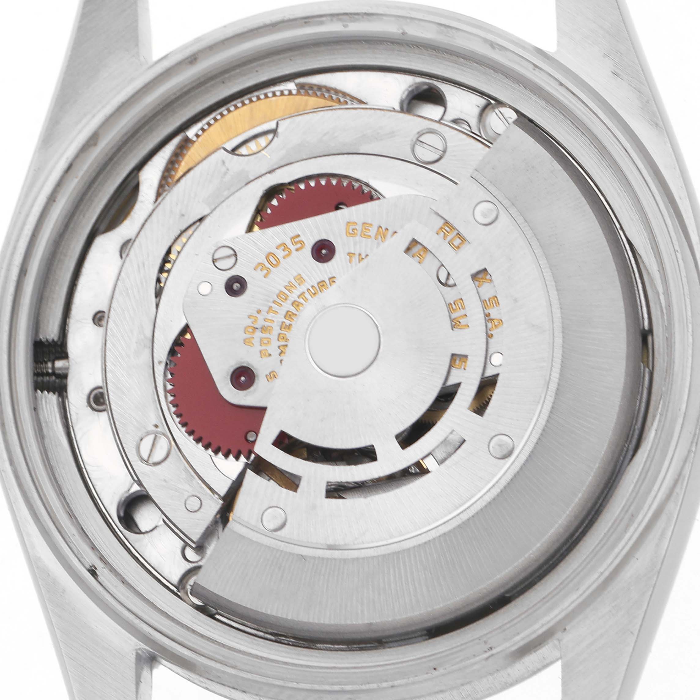 This image shows the movement of a Rolex Datejust 16014 Men
s Stainless Steel Silver Dial 16014 Men
s Stainless Steel Silver Dial viewed from the back, highlighting gears and the rotor.