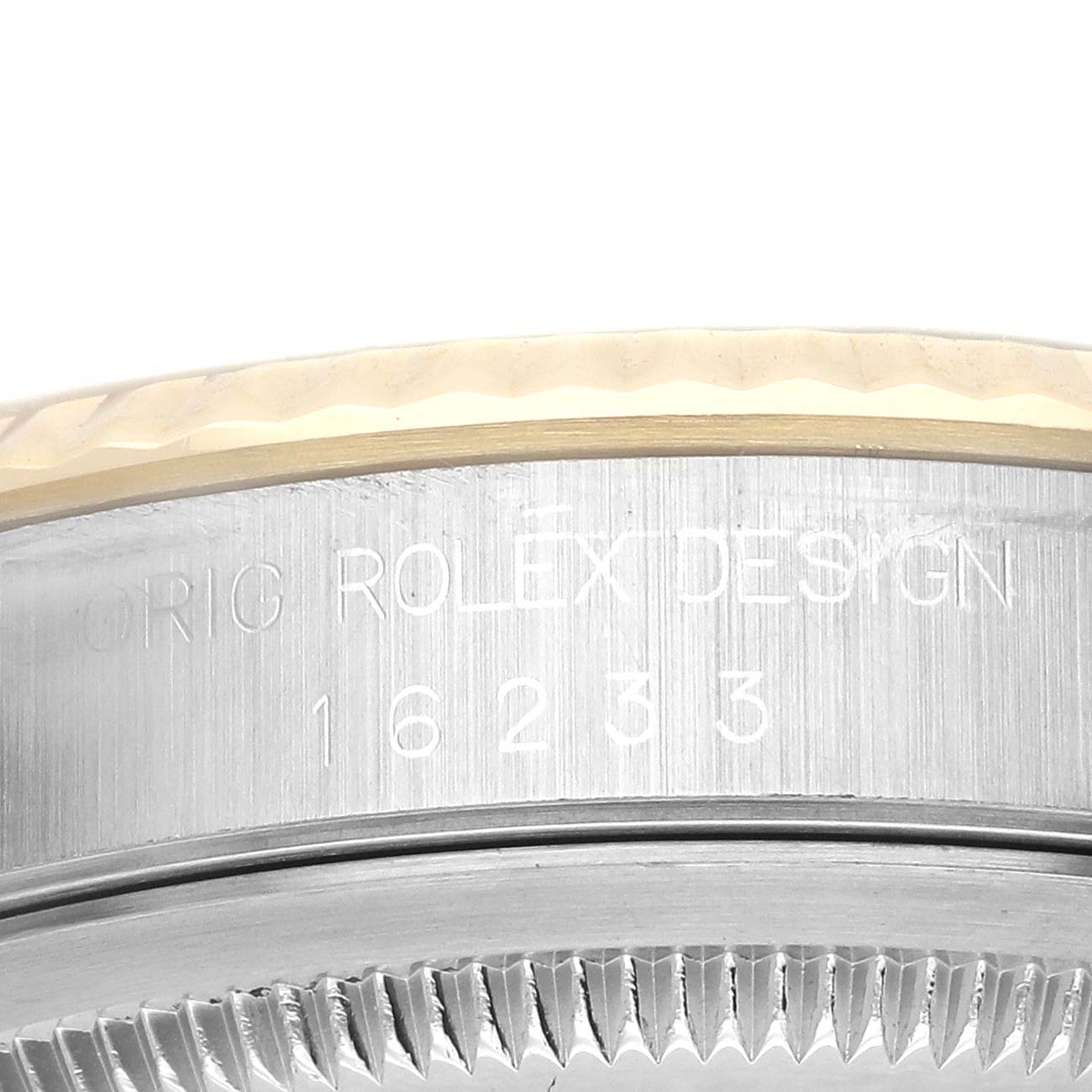 The image shows the side profile of a Rolex Datejust 16233 Men
s Steel and Gold (two tone) Champagne Dial 16233 Men
s Steel and Gold (two tone) Champagne Dial, focusing on the engraved case and bezel area.