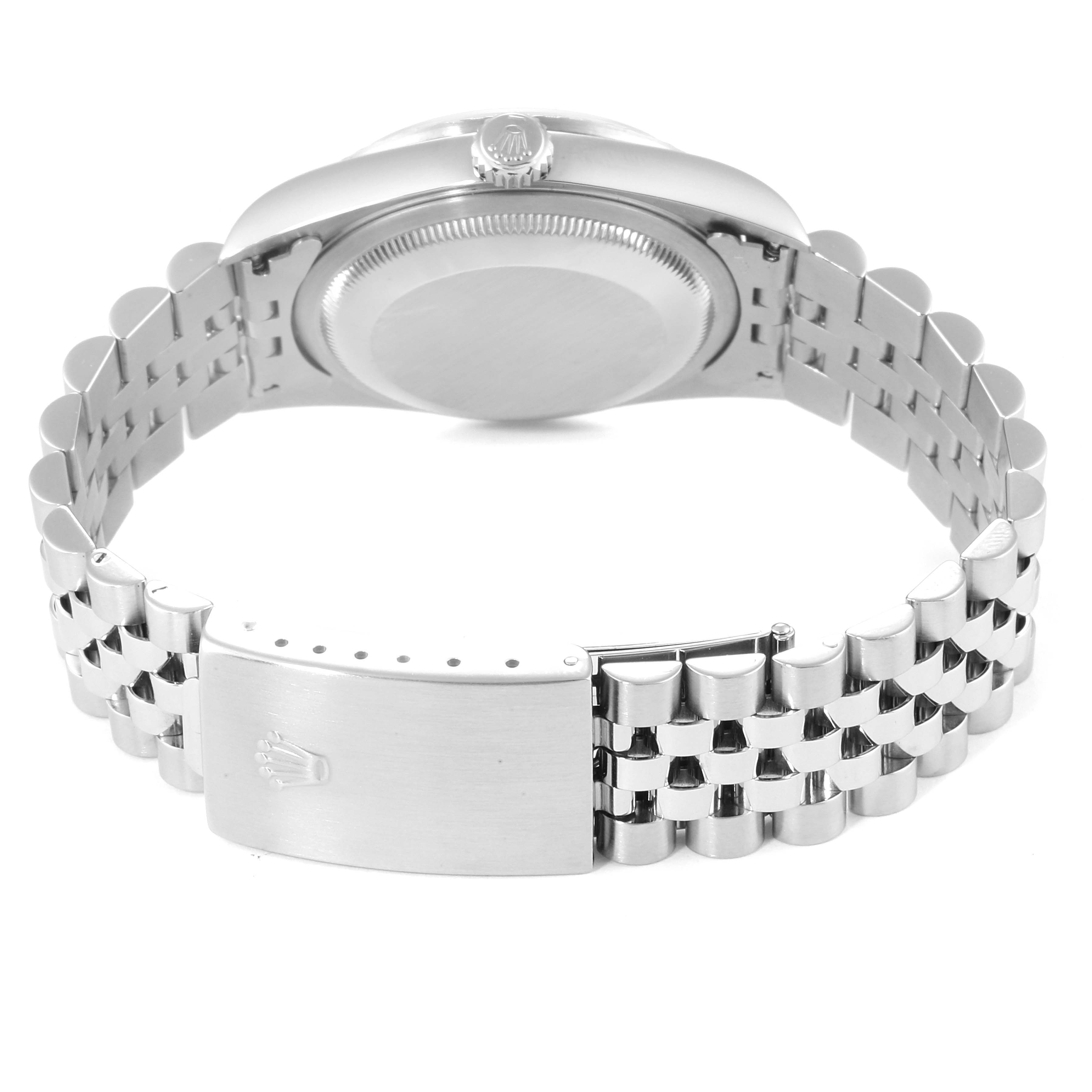 This image shows the back of the Rolex Datejust 16220 Men's Stainless Steel White Dial 16220 Men's Stainless Steel White Dial watch, including the case back and bracelet with the clasp open.