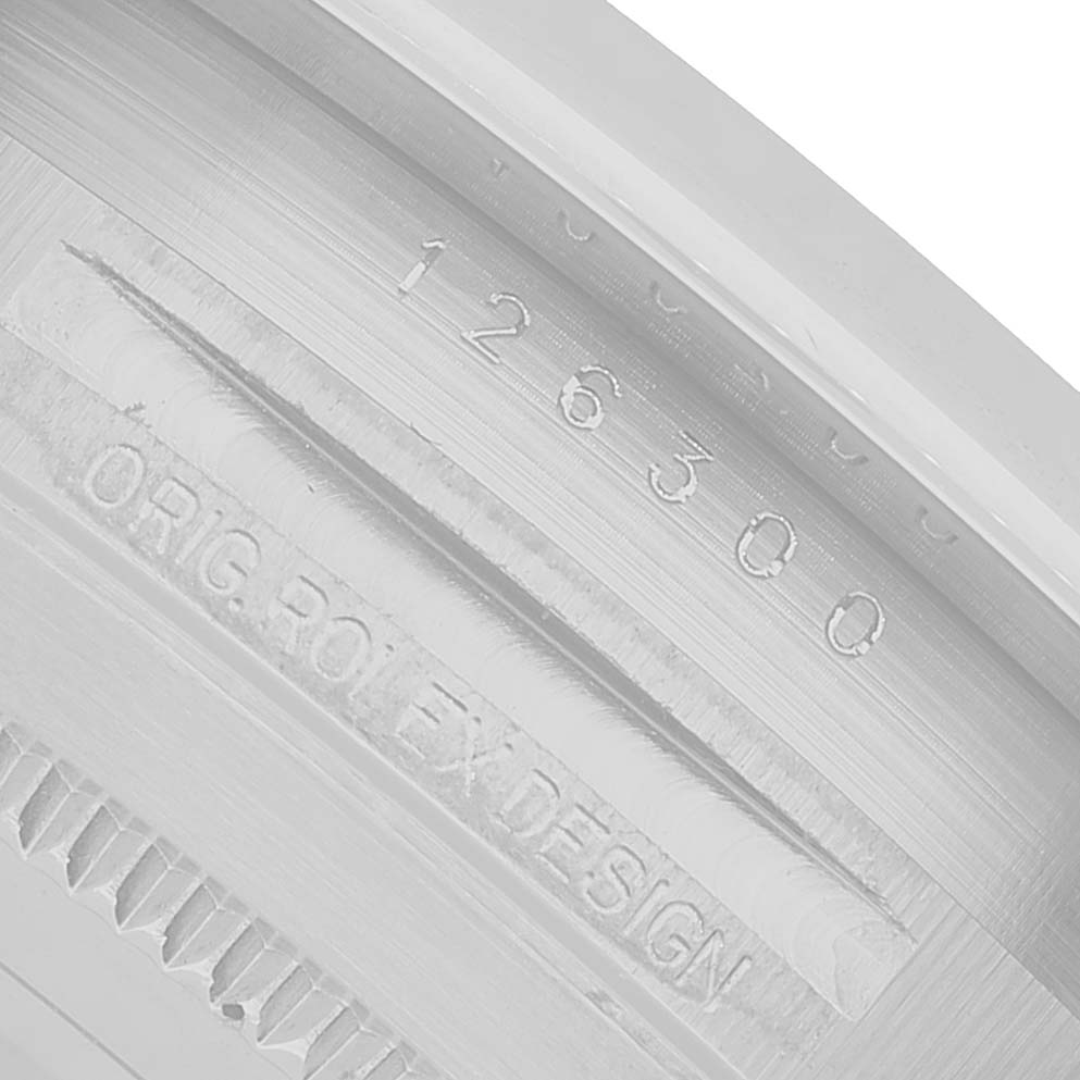 The image shows an angled close-up of the inner bezel and model number engraving on the Rolex Datejust 41 126300 Men's Stainless Steel White Dial.