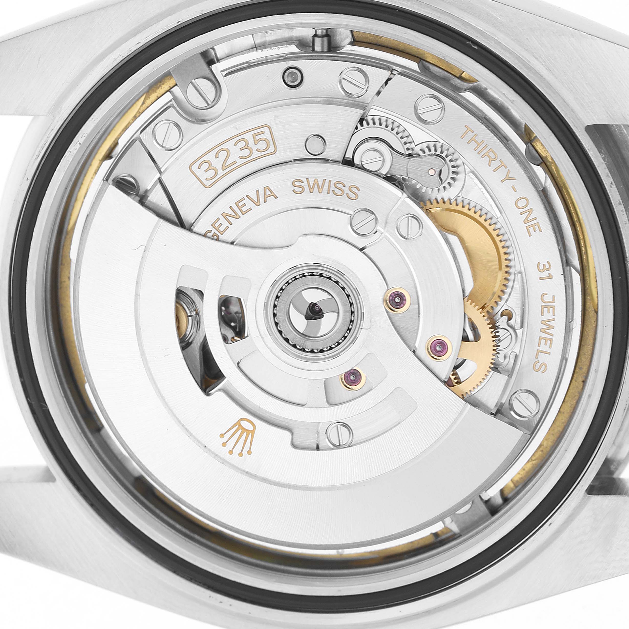 The image shows the Rolex Datejust 41 126300 Men's Stainless Steel White Dial's movement from the back, highlighting the rotor, gears, and inscriptions.
