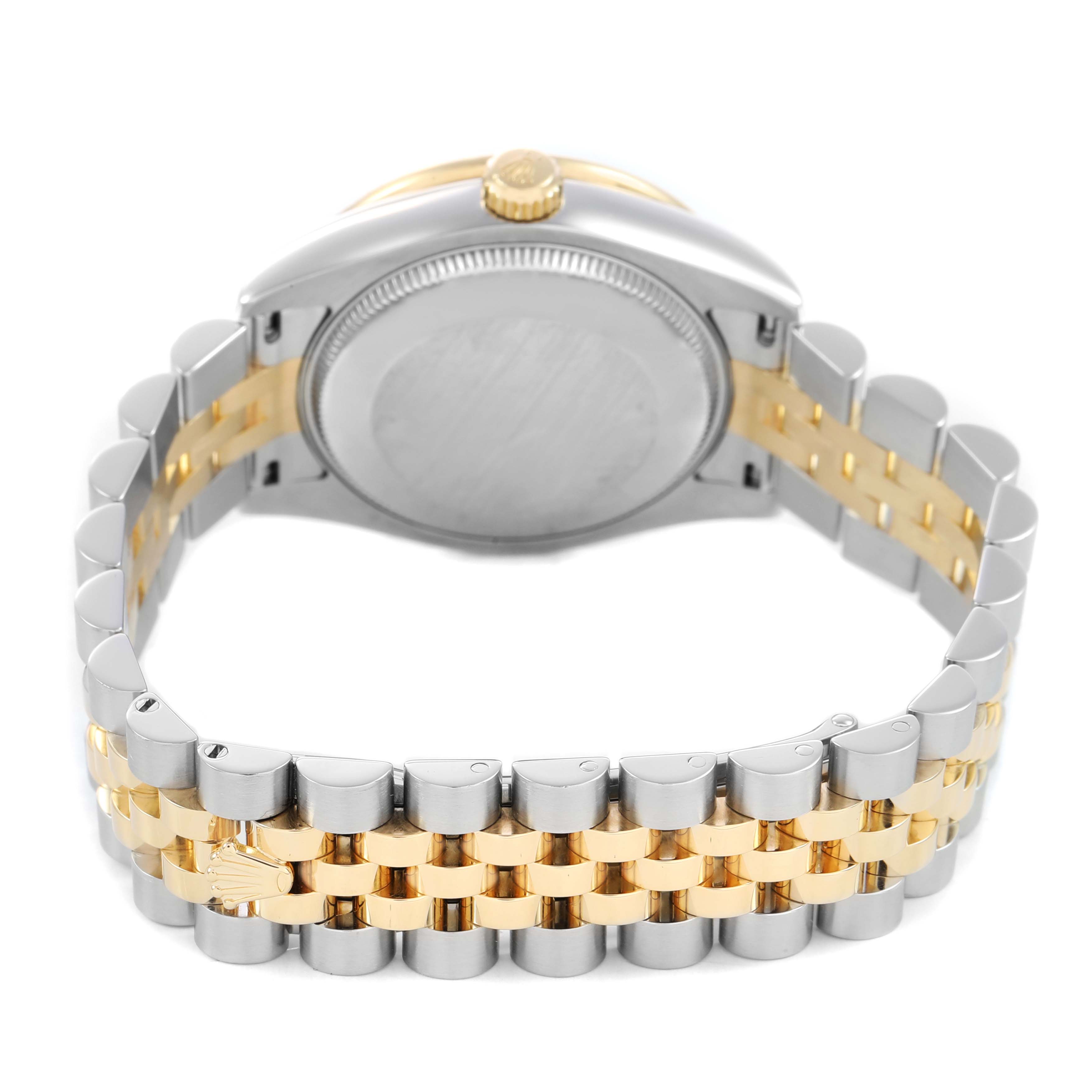 The image shows the back of the Rolex Datejust 31mm, highlighting its two-tone bracelet and gold crown.