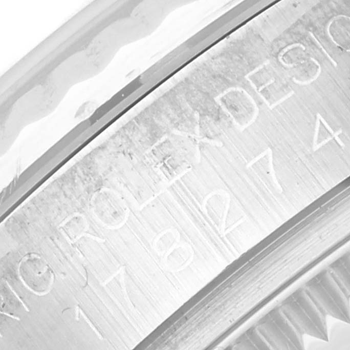 This image shows the engraved side of the case of a mid-size Rolex watch.