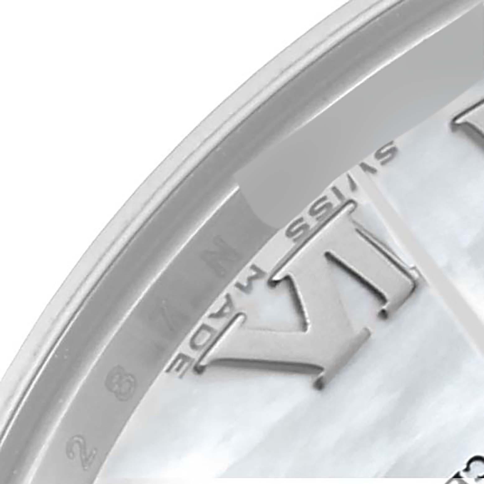 The image shows a close-up of the dial
s edge, including Roman numeral markers and the inscription "SWISS MADE," on a Mid-Size Rolex watch.