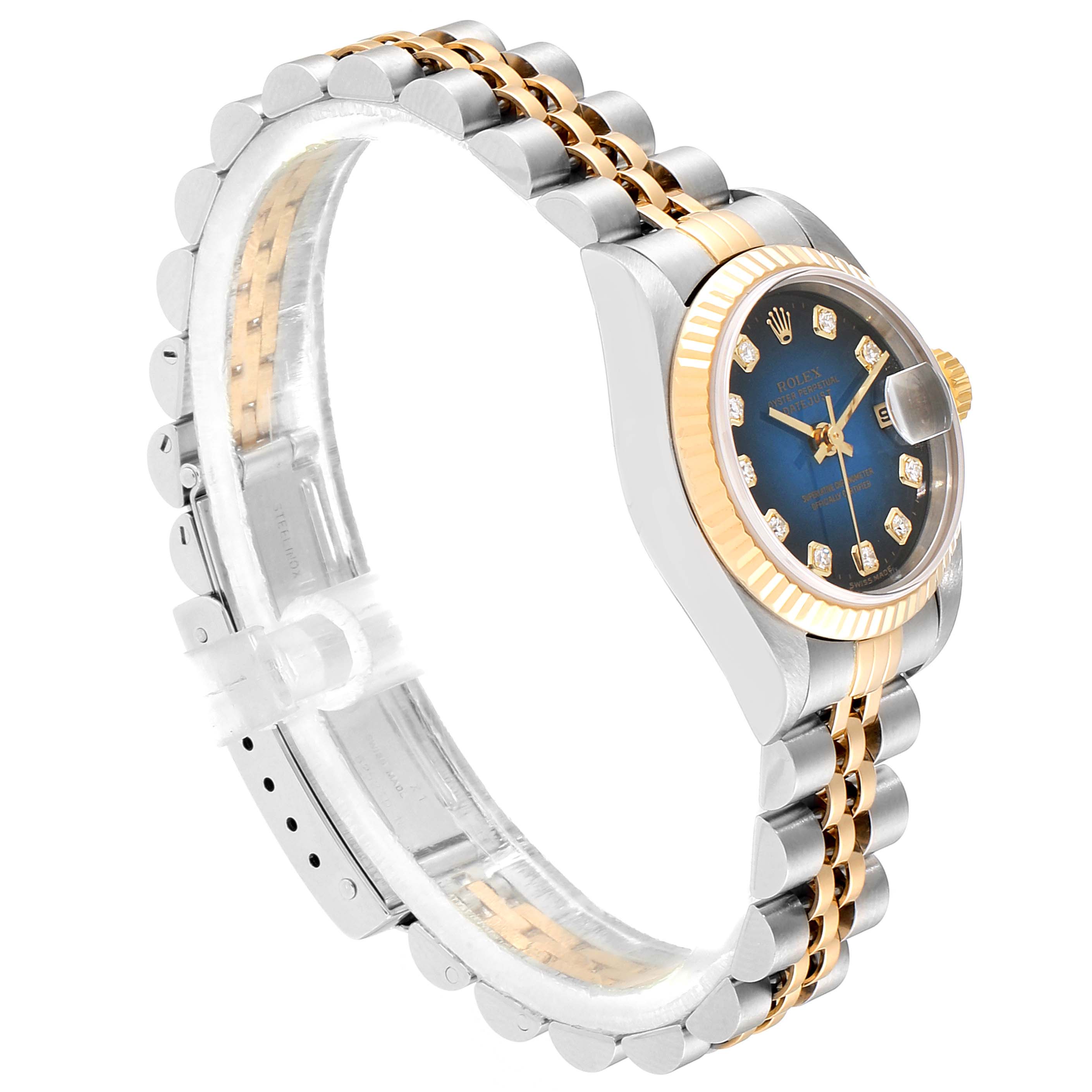 The image shows a side angle of a Rolex Datejust 79173 Women's Steel and Gold (two tone) Blue Dial 79173 Women's Steel and Gold (two tone) Blue Dial watch, featuring its dial, bezel, and two-tone bracelet.