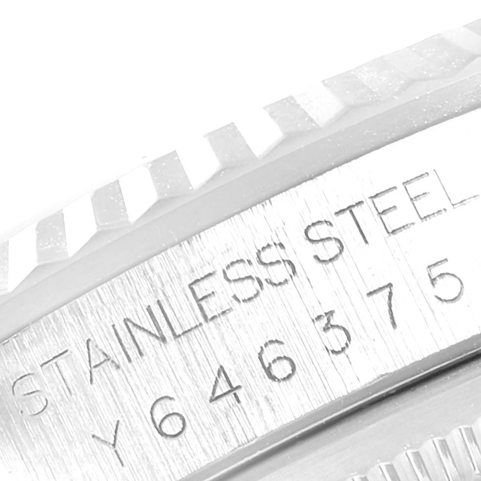 The image shows a close-up of the engraved stainless steel case and fluted bezel of the Rolex Datejust 16234 Men
s Stainless Steel Black Dial 16234 Men
s Stainless Steel Black Dial watch.