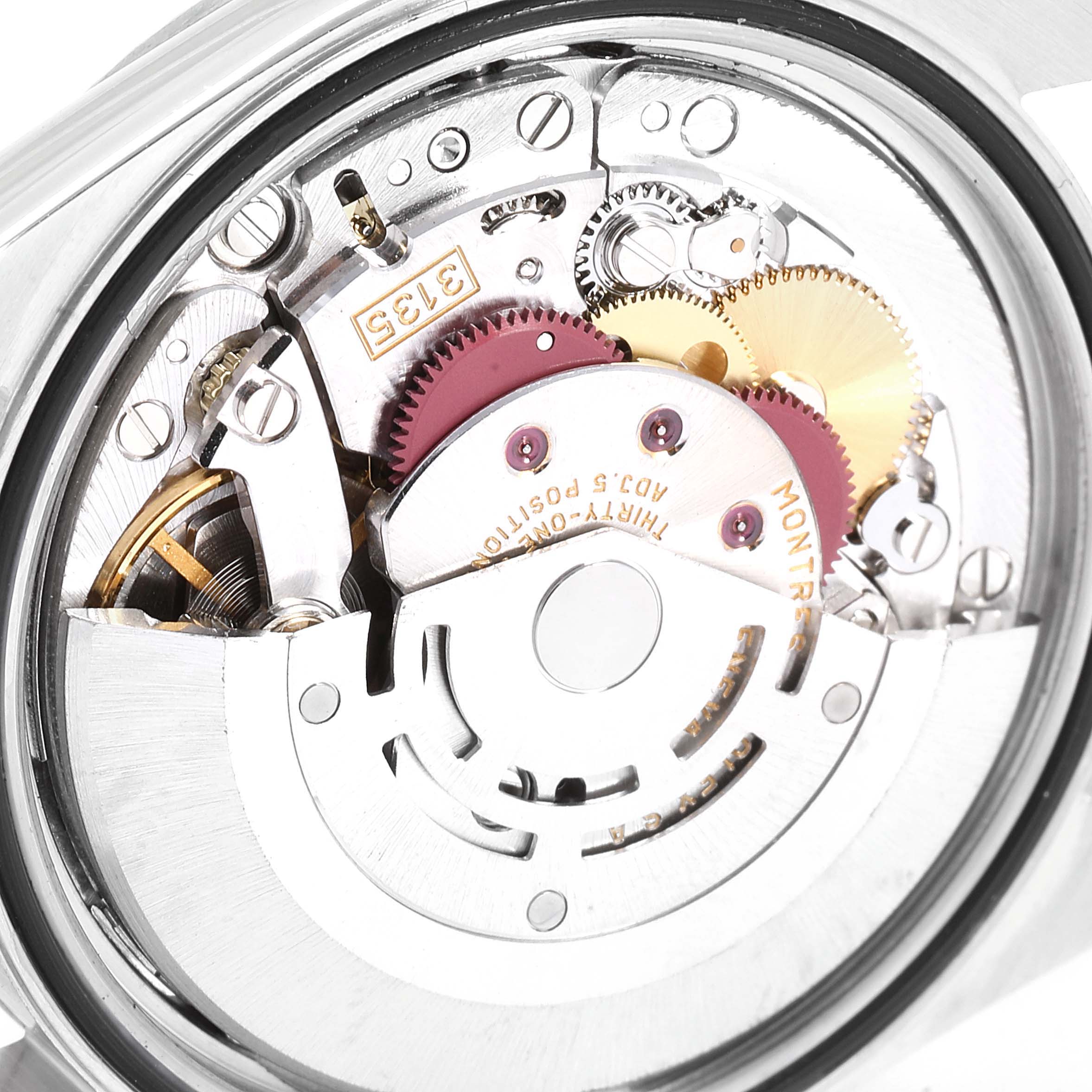 The image shows a close-up view of the movement mechanism of a Rolex Datejust 16234 Men
s Stainless Steel Black Dial 16234 Men
s Stainless Steel Black Dial watch.
