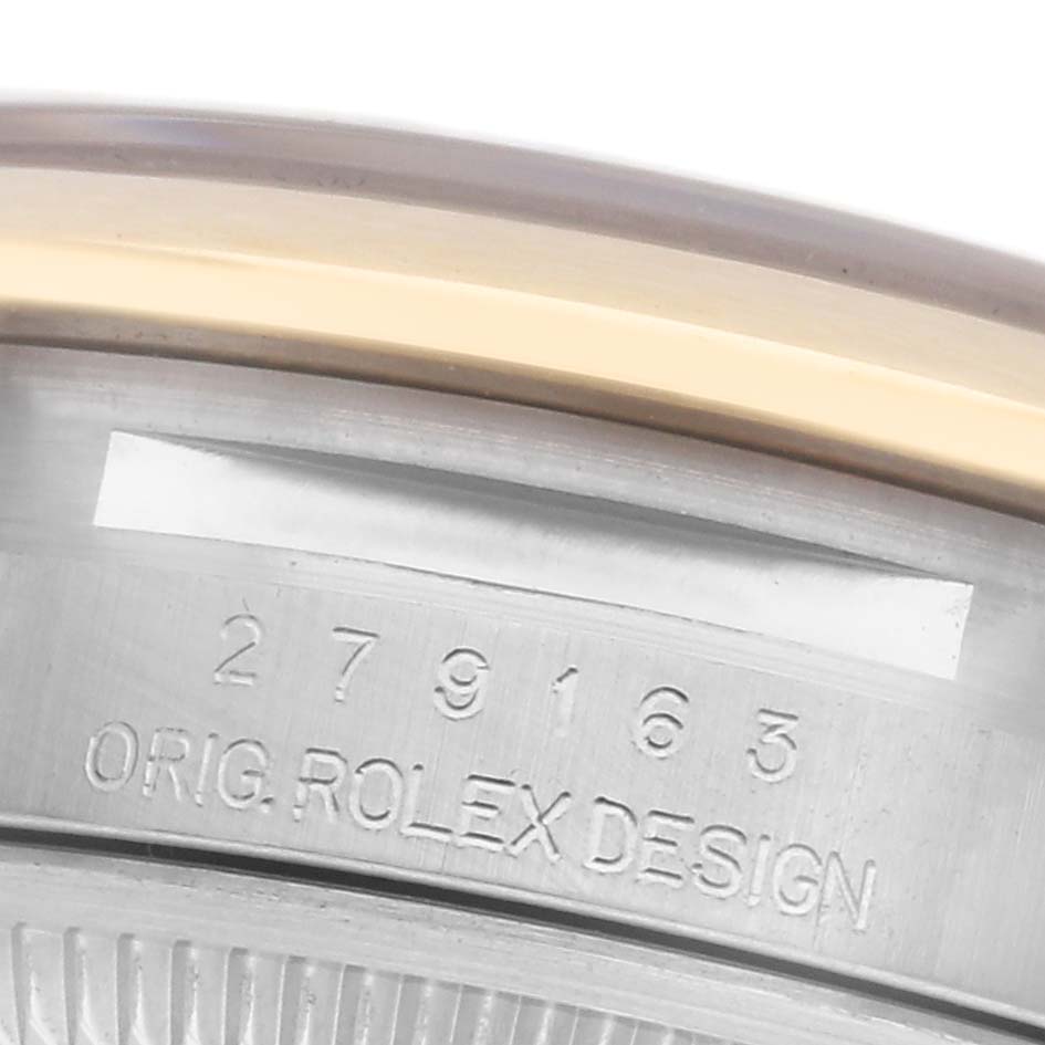 The image shows a close-up of the underside with the serial number and "ORIG. ROLEX DESIGN" on the Rolex Datejust 279163 Women
s Steel and Gold (two tone) Champagne Dial 279163 Women
s Steel and Gold (two tone) Champagne Dial.