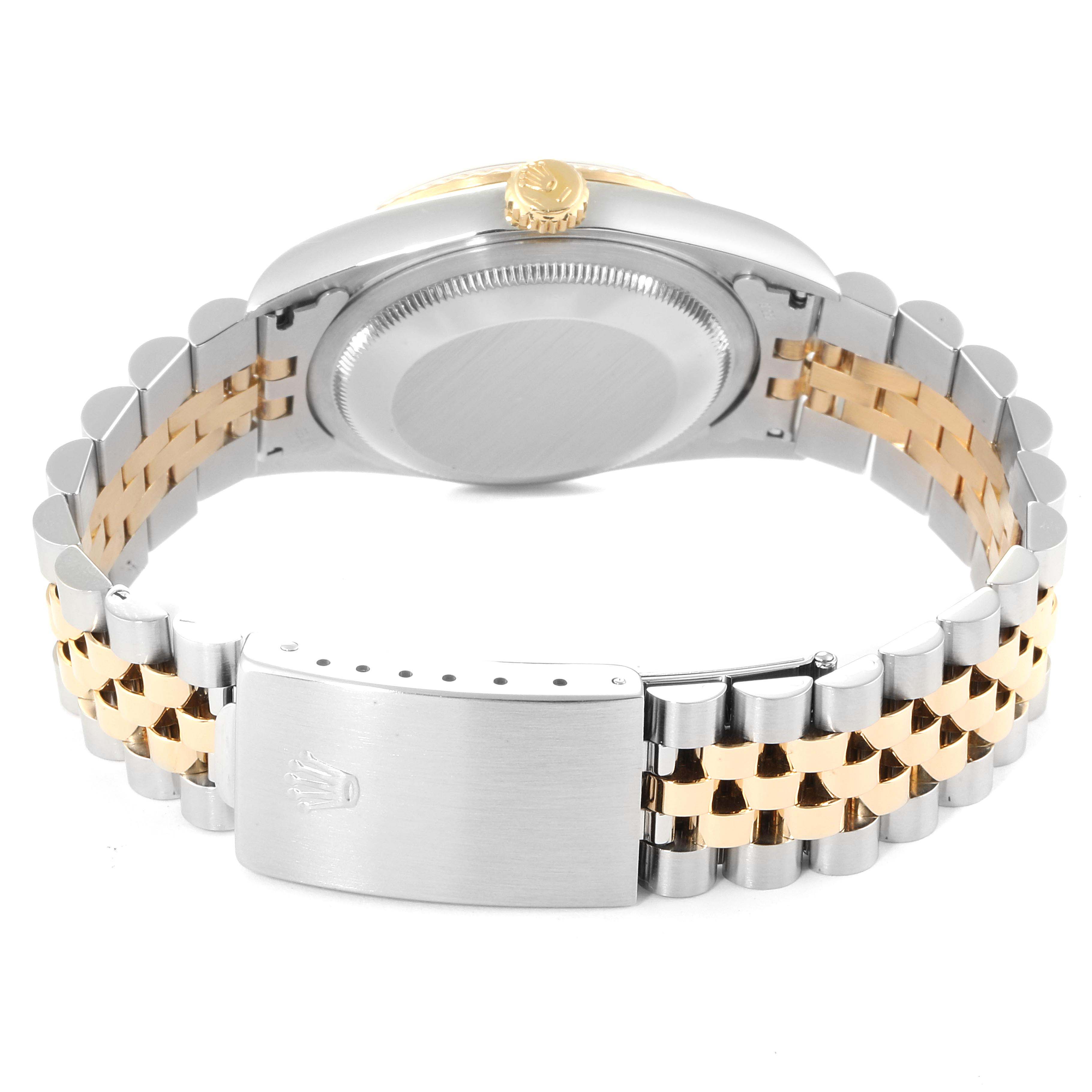 The image shows the back of a Rolex Datejust 16233 Men
s Steel and Gold (two tone) Champagne Dial 16233 Men
s Steel and Gold (two tone) Champagne Dial watch, highlighting its bi-color bracelet and clasp.