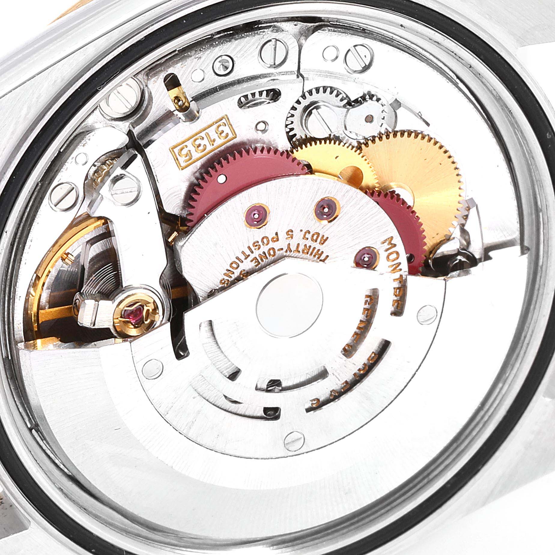 The image shows the intricate internal mechanism of a Rolex Datejust 16233 Men
s Steel and Gold (two tone) Champagne Dial 16233 Men
s Steel and Gold (two tone) Champagne Dial watch, viewed from the back.
