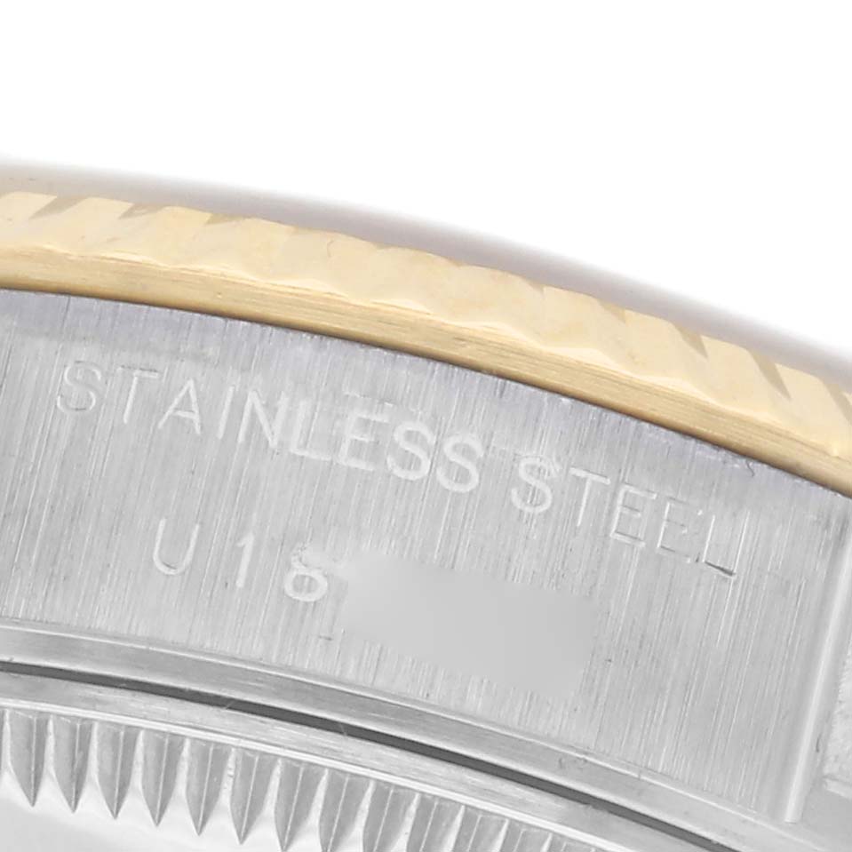 The image shows a close-up view of the case side of a Rolex Datejust 69173 Women's Steel and Gold (two tone) Champagne Dial 69173 Women's Steel and Gold (two tone) Champagne Dial, highlighting the stainless steel and engraved details.