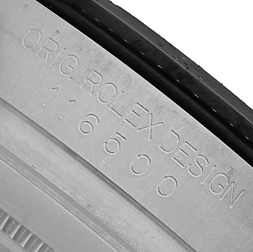 The image shows a close-up of the case engraving with model number "116500" on a Rolex Daytona 116500 Men's Stainless Steel Black Dial.