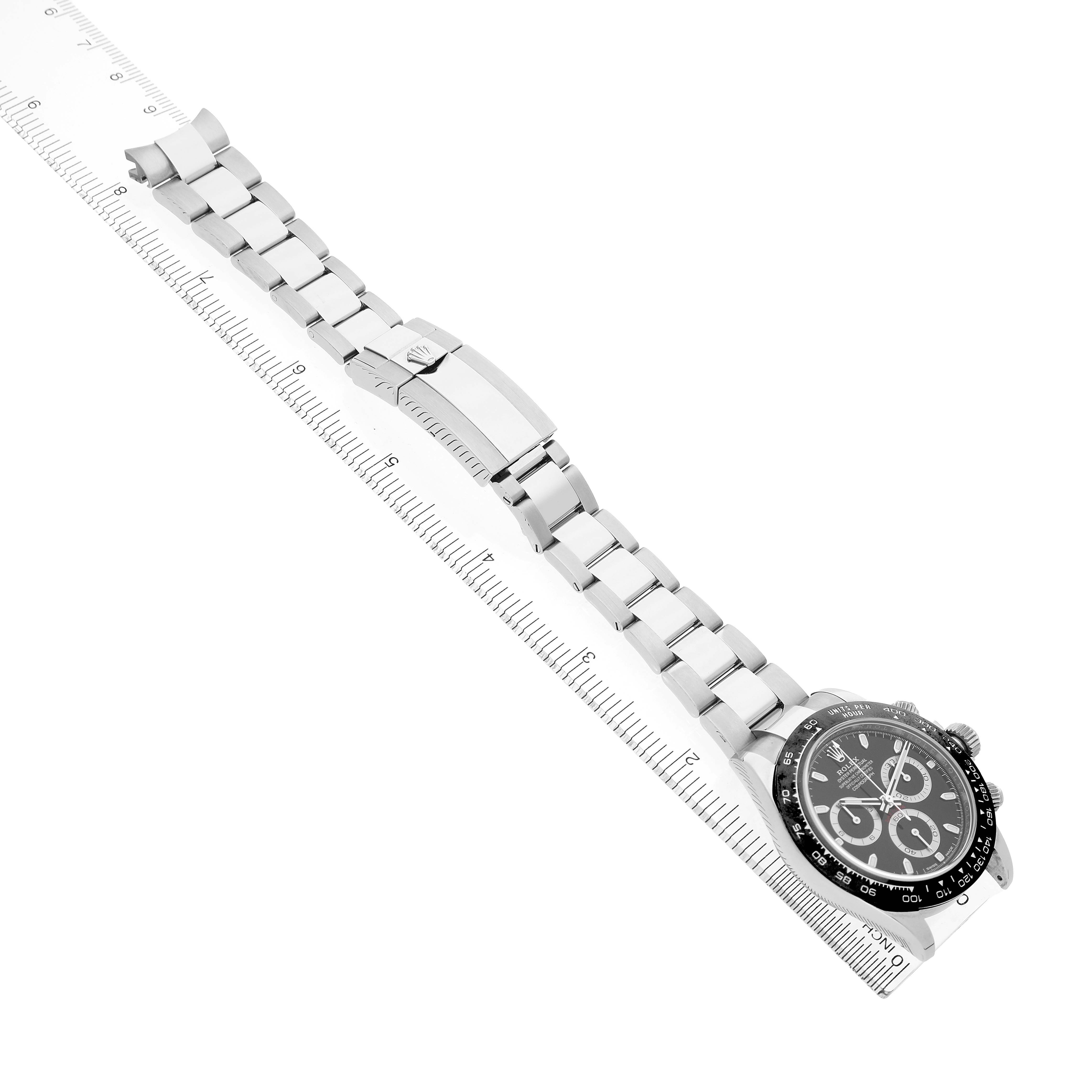 The Rolex Daytona 116500 Men's Stainless Steel Black Dial watch is shown from a top view, displaying its bracelet, clasp, and partial face.