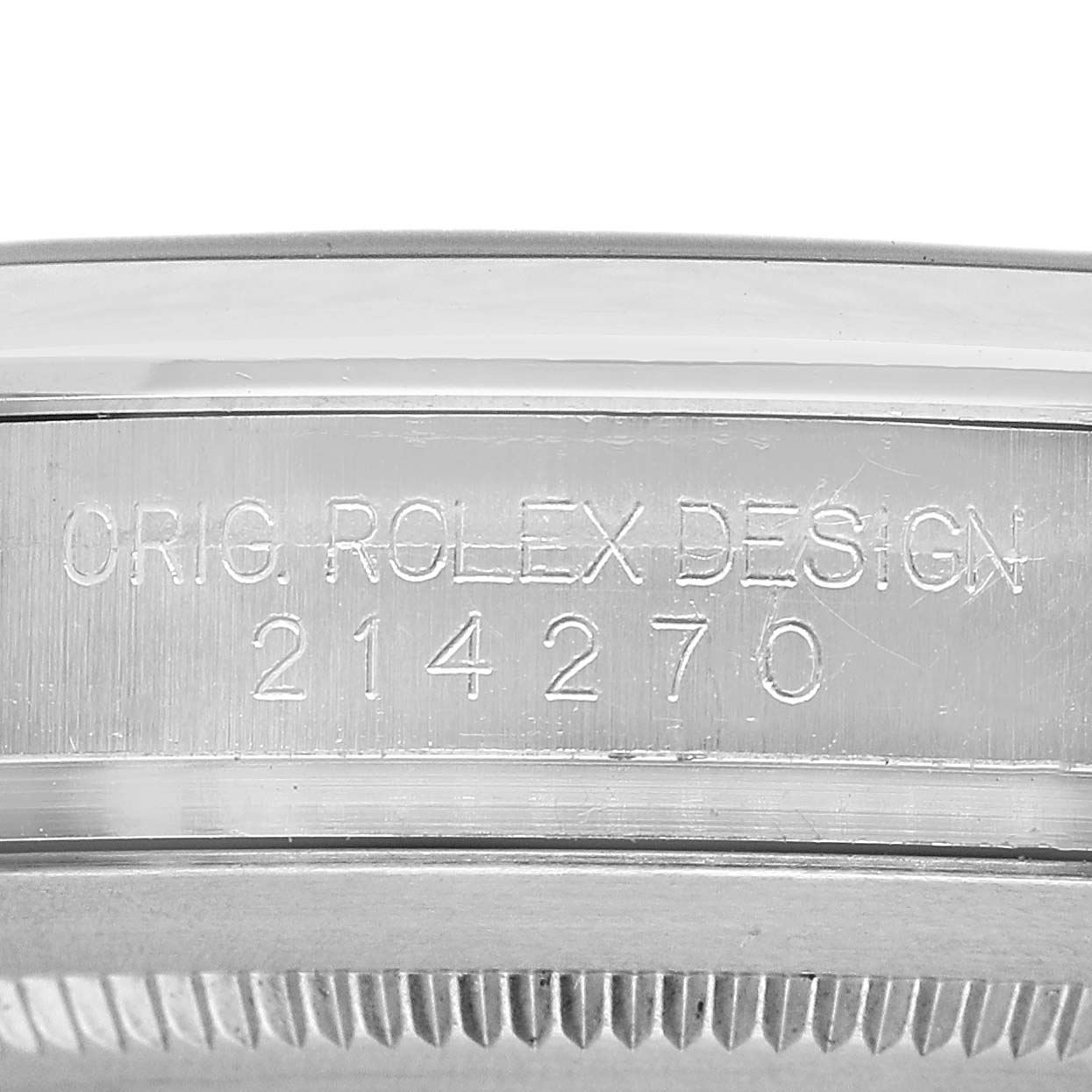 The image shows a close-up of the engraved inner rim of the Rolex Explorer 214270 Men's Stainless Steel Black Dial's bezel, featuring the model number 214270.