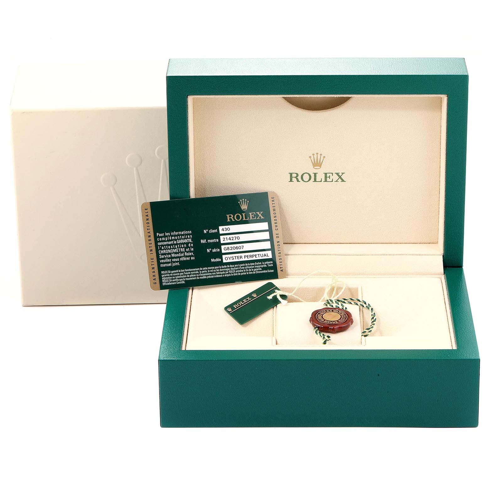 A Rolex Explorer 214270 Men
s Stainless Steel Black Dial 214270 Men
s Stainless Steel Black Dial box, open, showing the warranty card, tags, and accessories inside.