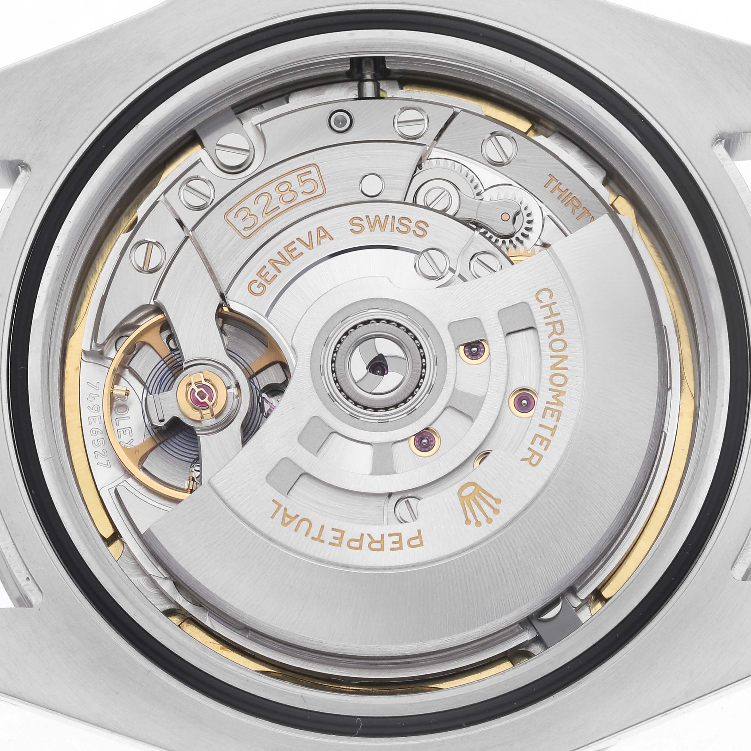 This image shows the Rolex Explorer 226570 Men
s Stainless Steel Black Dial 226570 Men
s Stainless Steel Black Dial
s movement, viewed from the back, highlighting gears and inscriptions.