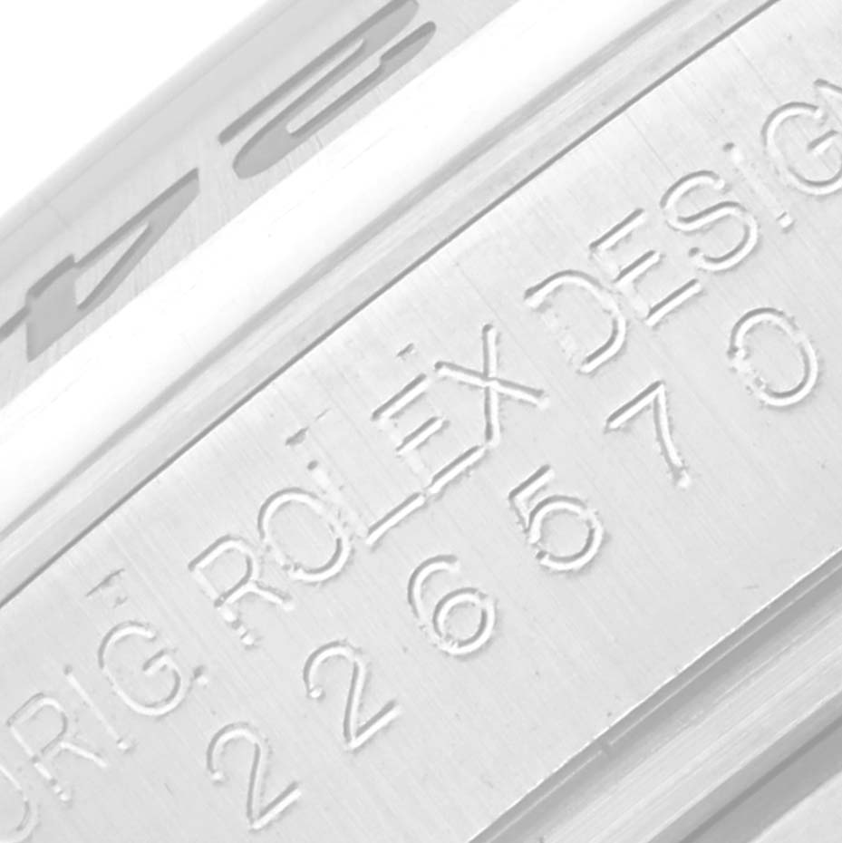 This close-up image shows the engraved edge of the bezel of a Rolex Explorer 226570 Men's Stainless Steel White Dial 226570 Men's Stainless Steel White Dial watch.