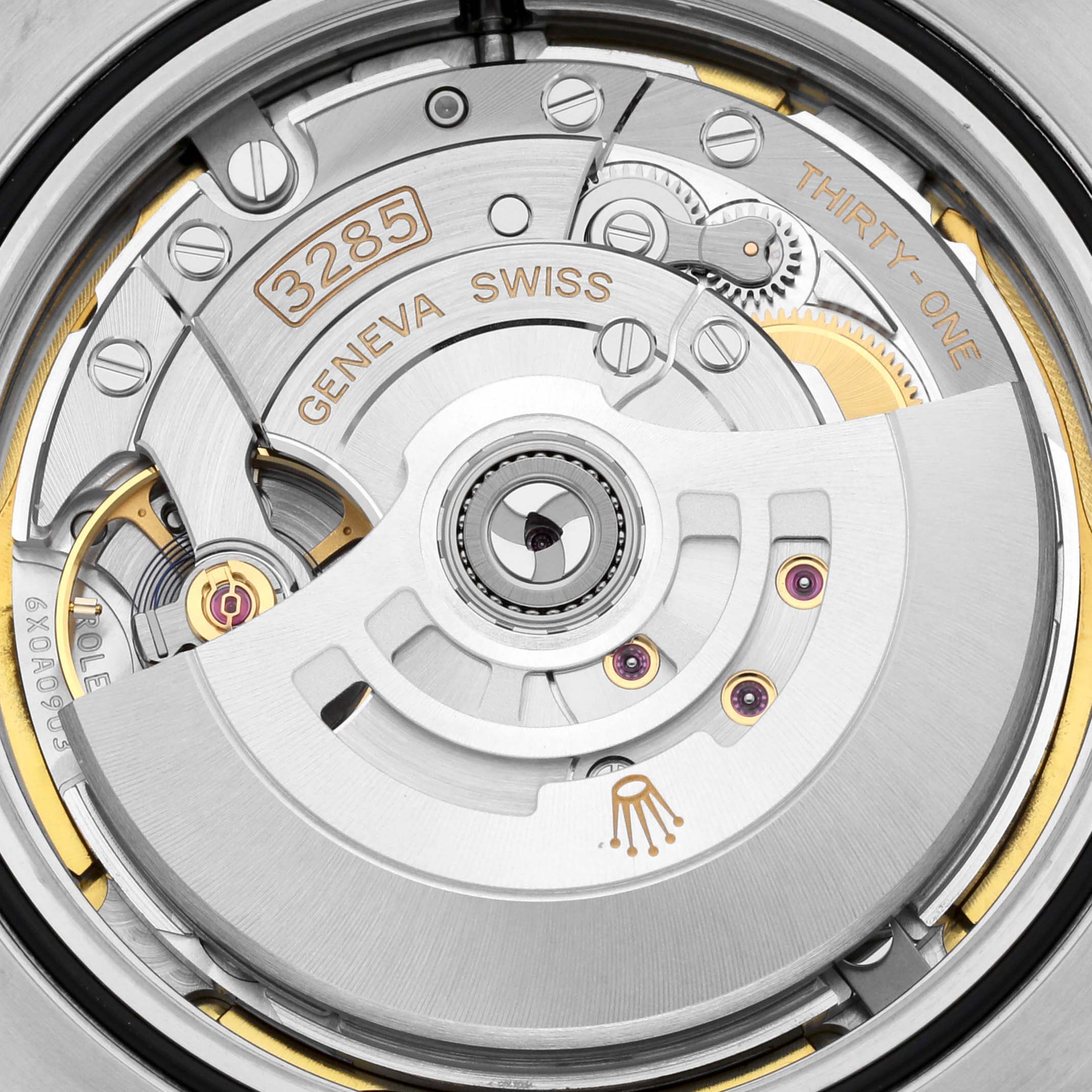 This is a close-up shot of the movement inside a Rolex Explorer 226570 Men's Stainless Steel White Dial 226570 Men's Stainless Steel White Dial watch, showing intricate details and the "GENEVA SWISS" inscription.
