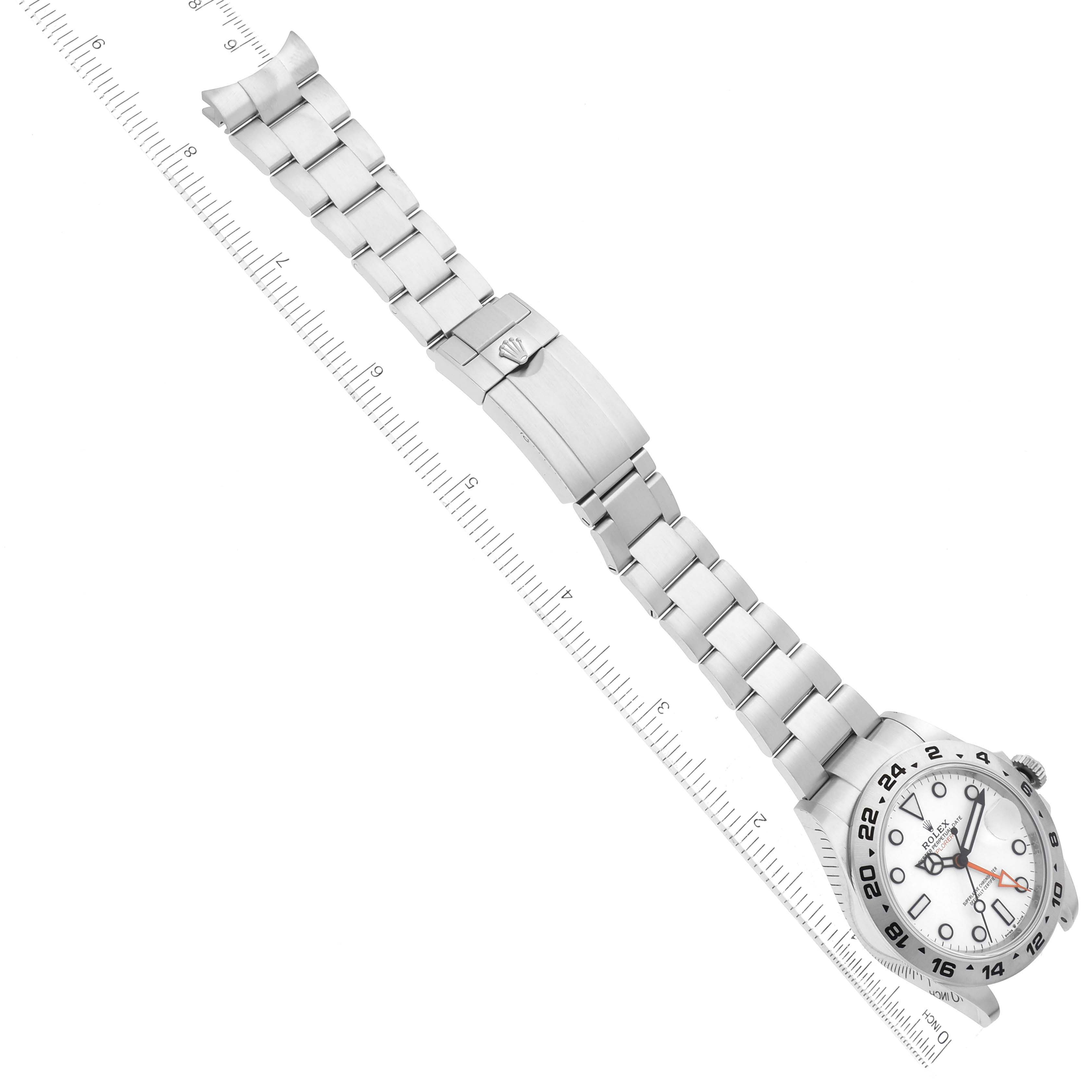 The Rolex Explorer 226570 Men's Stainless Steel White Dial 226570 Men's Stainless Steel White Dial watch is shown from an angled aerial perspective, highlighting the case, dial, bracelet, and clasp.