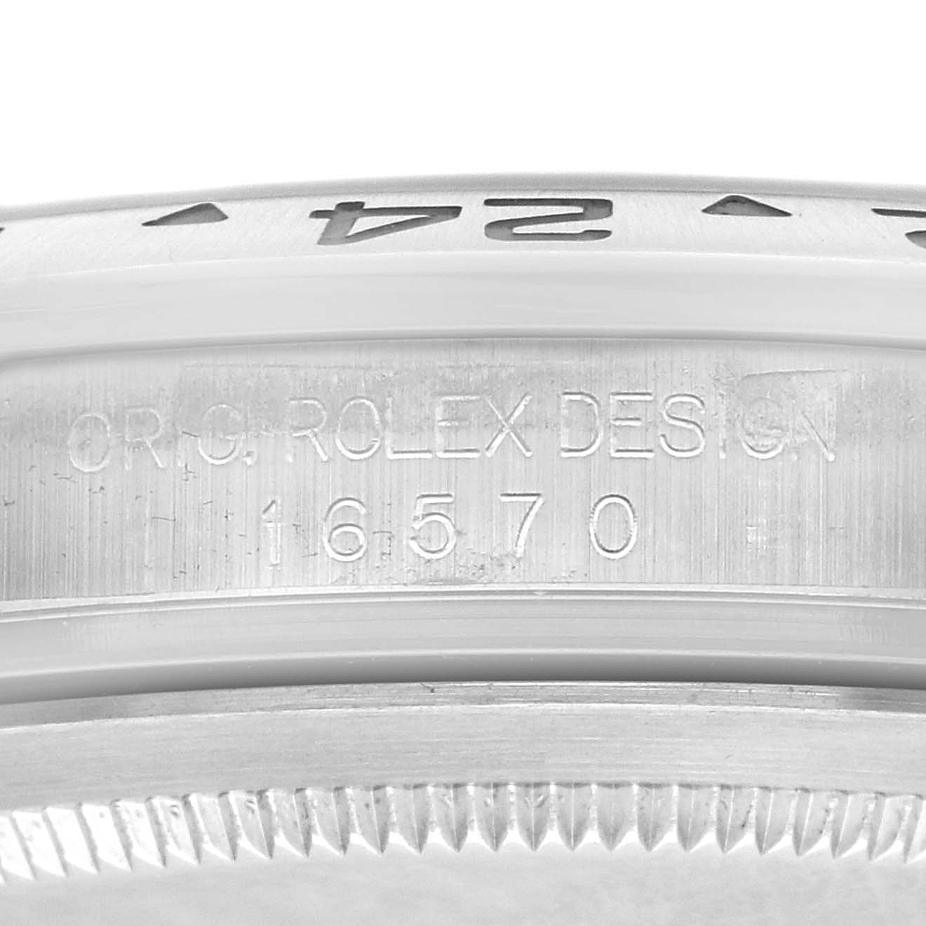 The image shows a close-up of the side of a Rolex Explorer 16570 Men
s Stainless Steel White Dial 16570 Men
s Stainless Steel White Dial, highlighting its bezel and engraved model number.
