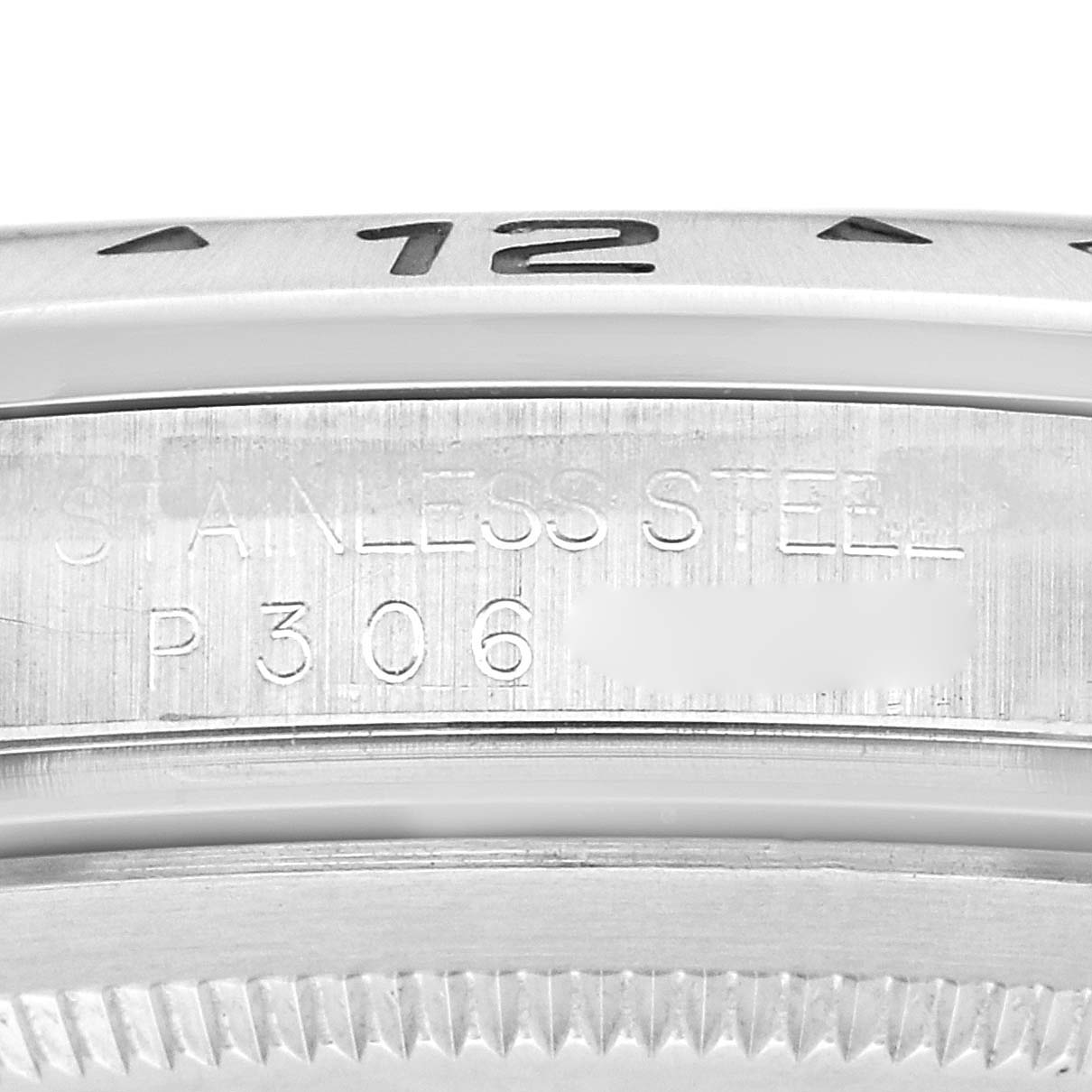 The image shows a close-up of the bezel and case edge of a Rolex Explorer 16570 Men
s Stainless Steel White Dial 16570 Men
s Stainless Steel White Dial watch, highlighting the inscription and numbering.