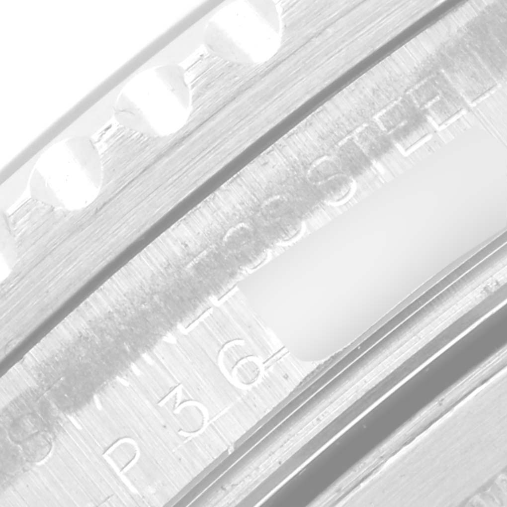 This is a close-up angle of the bezel and serial number area of a Rolex GMT-Master 16710 Men
s Stainless Steel Black Dial 16710 Men
s Stainless Steel Black Dial watch.